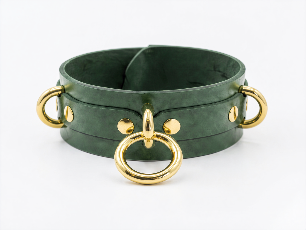 A green leather choker necklace with gold-colored metal rings and handles.