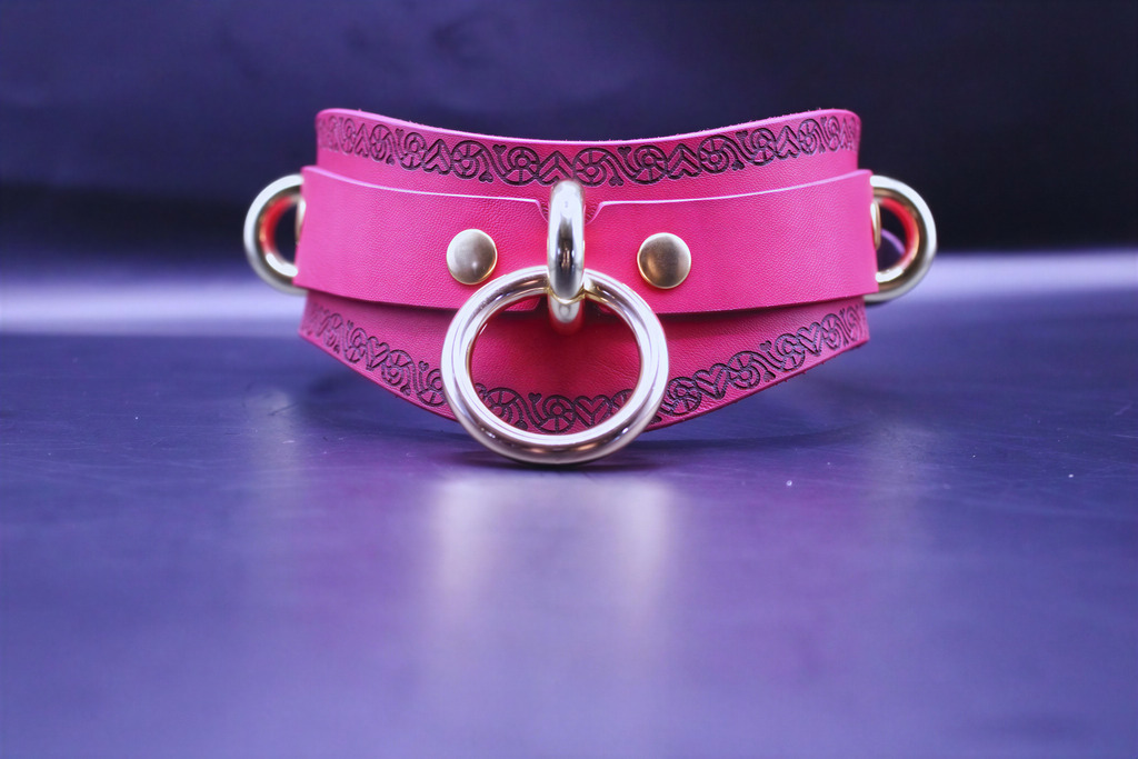 Handcrafted pink BDSM collar with O-ring, featuring a heart motif, perfect for submissive jewelry and BDSM accessories.