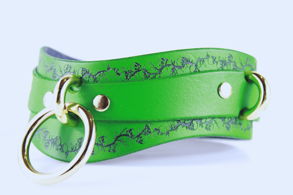 Skull Leather Choker with floral skull motif and gold hardware, perfect for a discreet yet rebellious accessory.