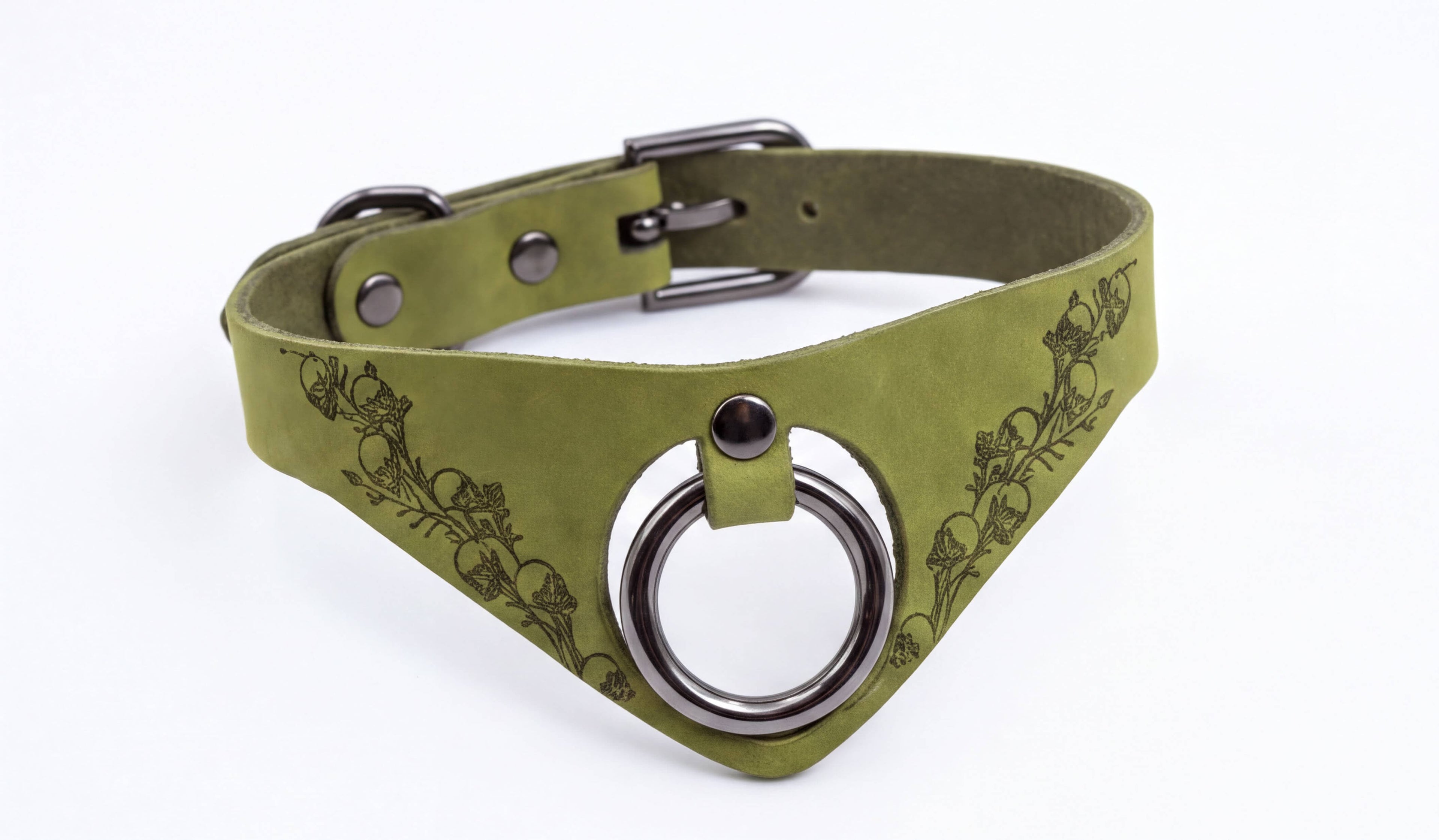 A green leather choker necklace with a metal ring and a floral design on the front.