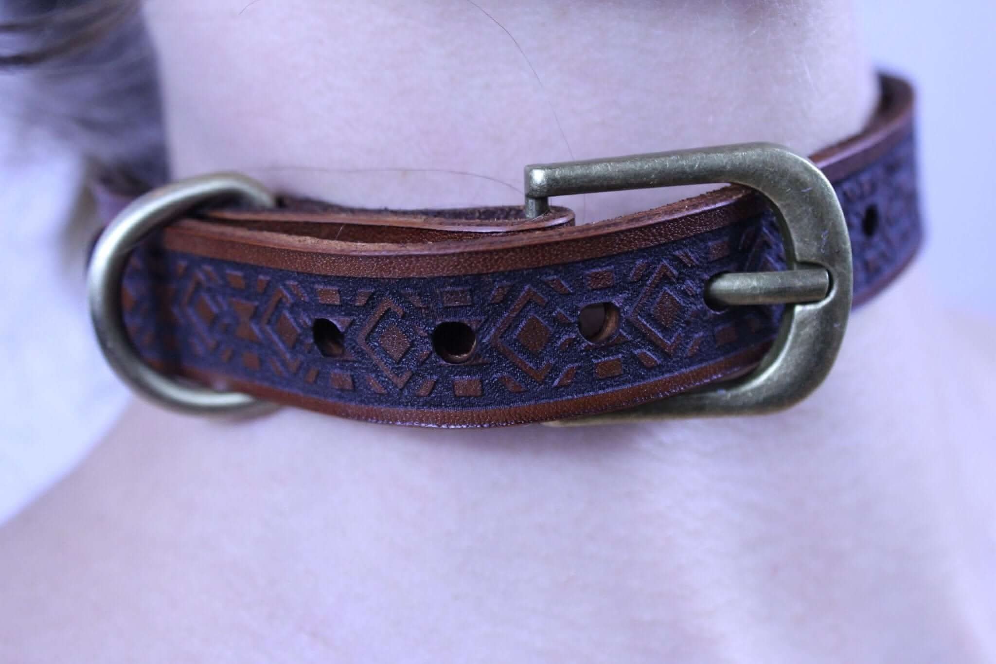 Geometric leather BDSM collar with embossed pattern, perfect for submissive accessories and discreet day wear.