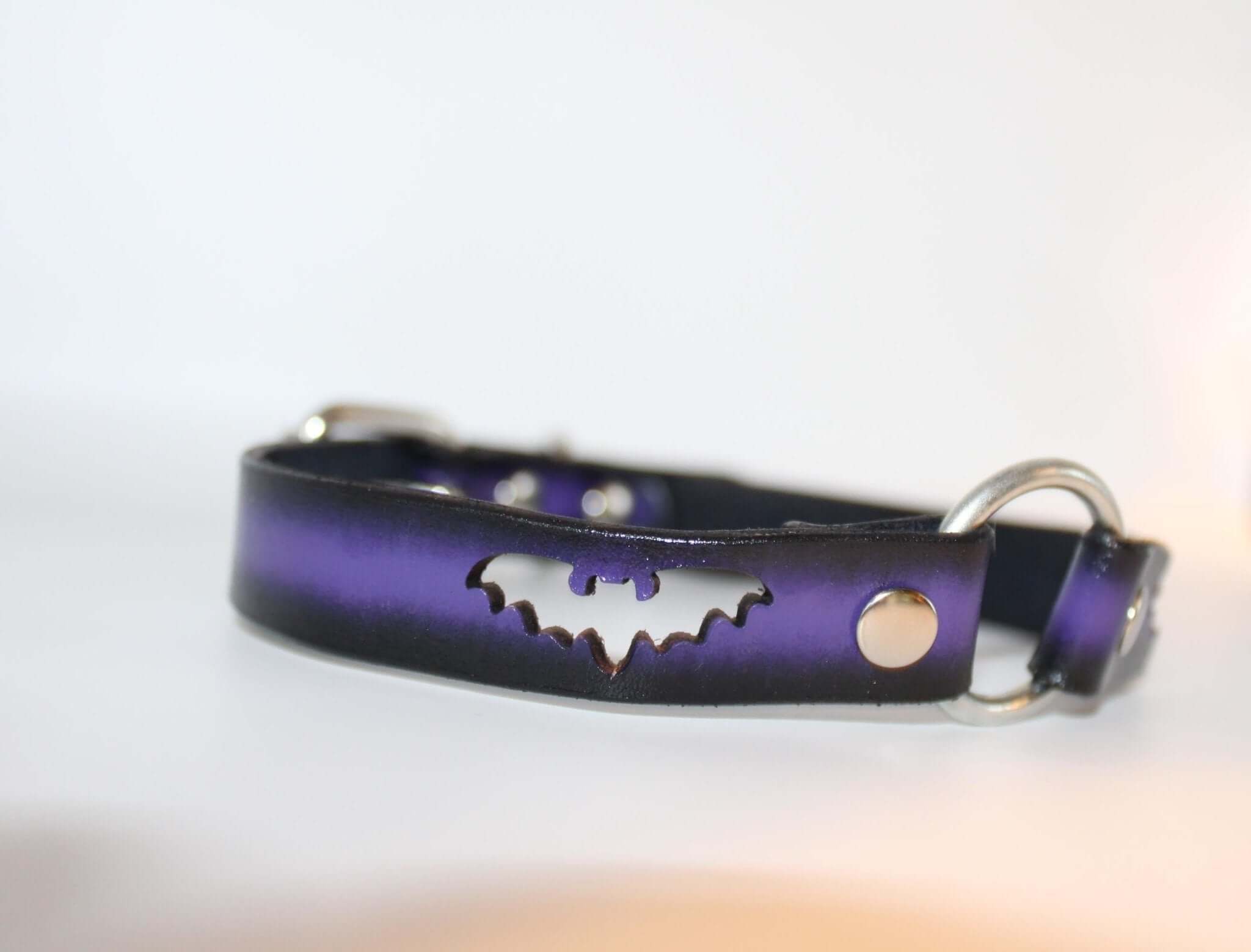 BDSM bat collar with unique bat cutout design in black and purple leather, perfect for gothic bondage fashion.