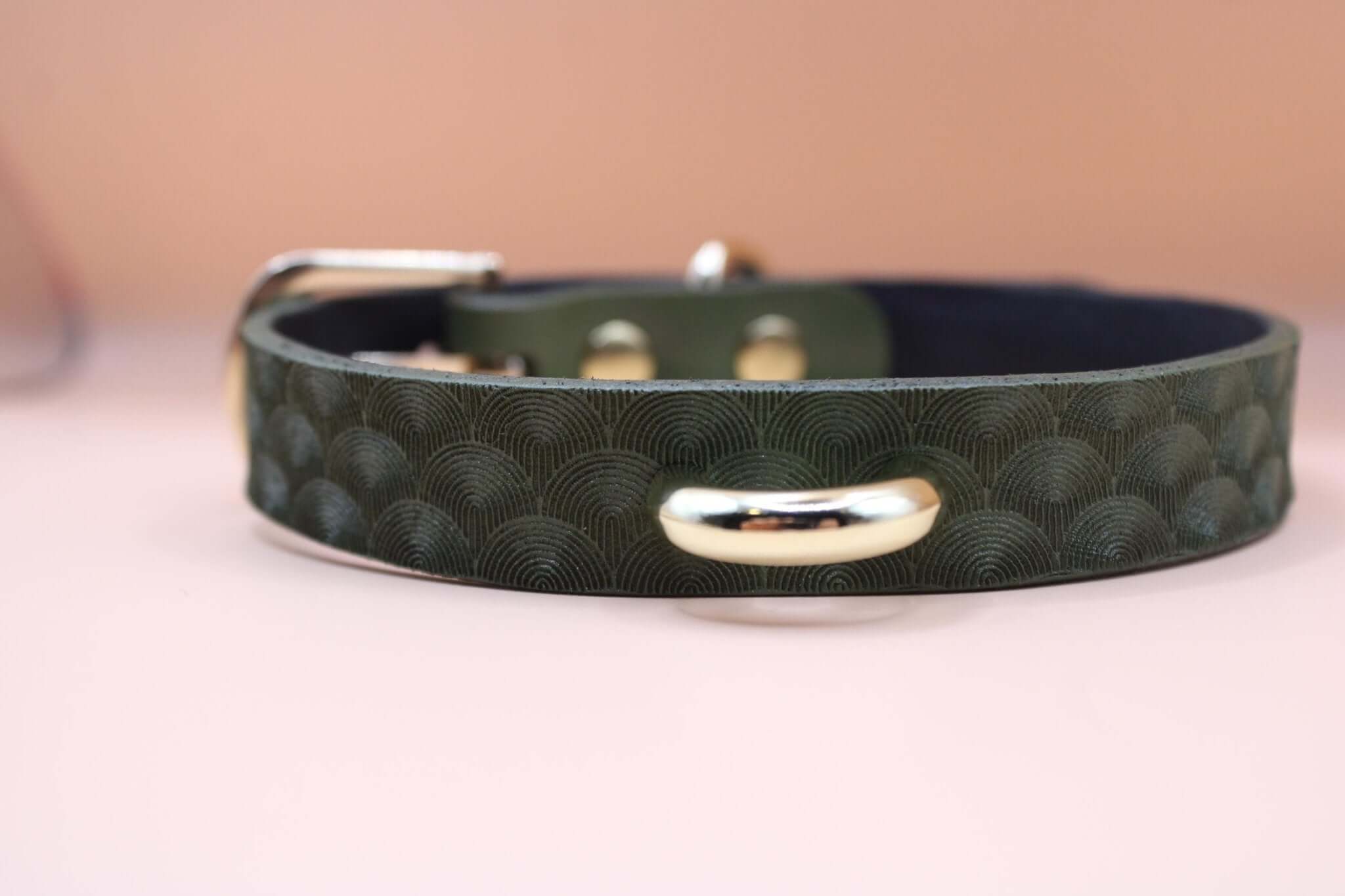 Elegant green leather choker collar with gold accents, perfect for discreet BDSM day wear and submissive jewelry.