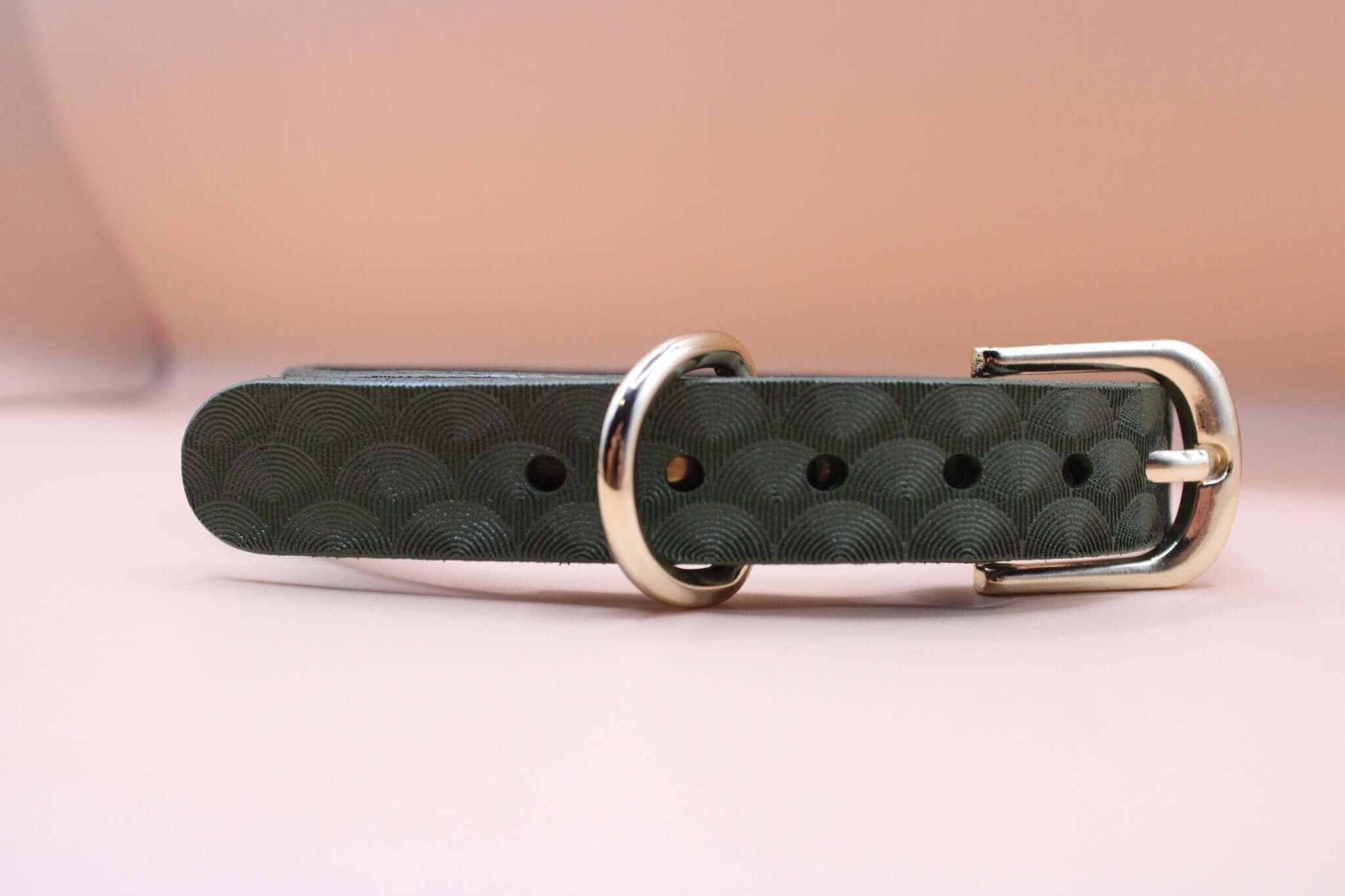 Elegant green leather choker collar with silver buckle, ideal for discreet day wear and BDSM style.