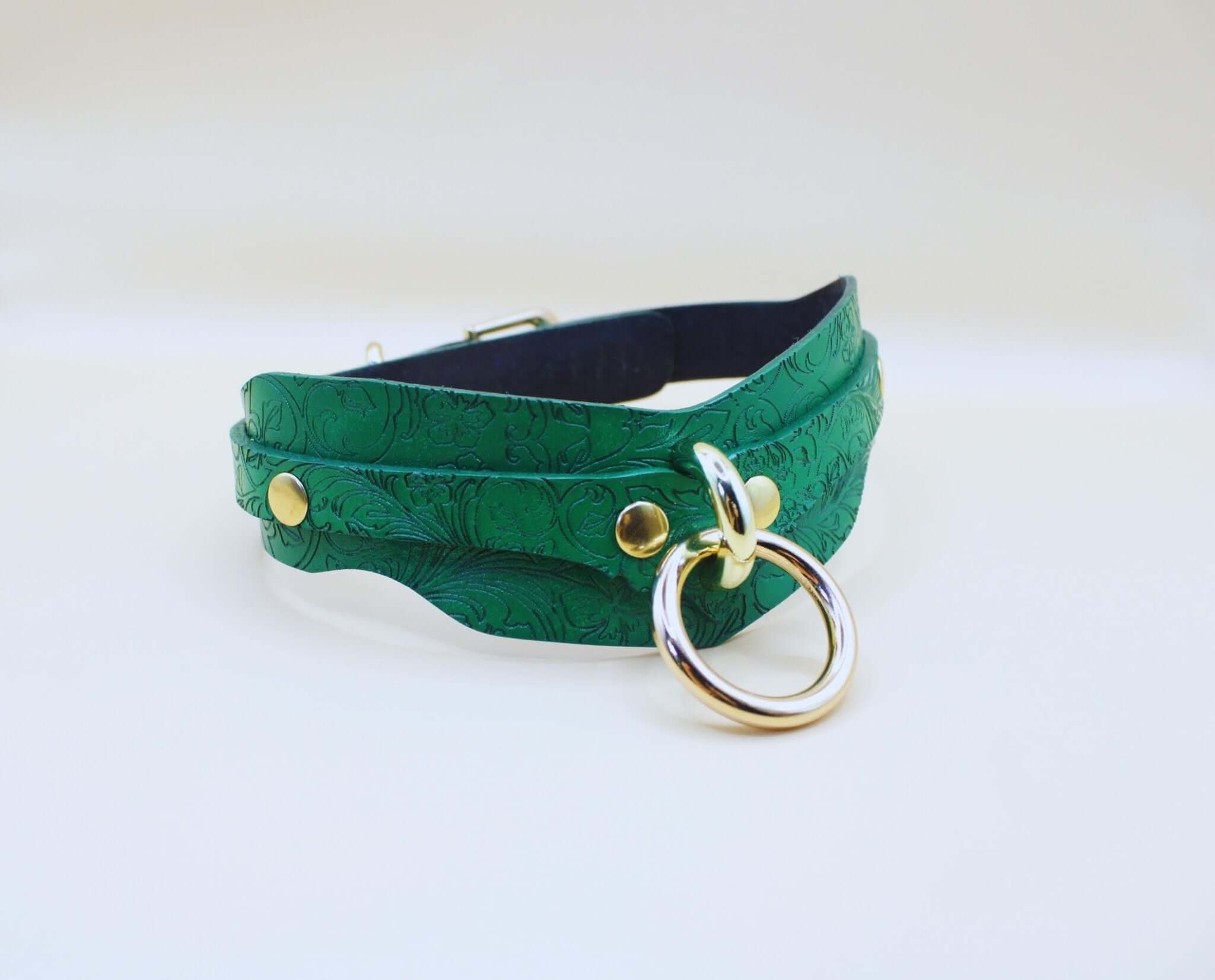 Green leather BDSM posture collar with floral embossing, perfect for submissive jewelry and discreet day collar style.