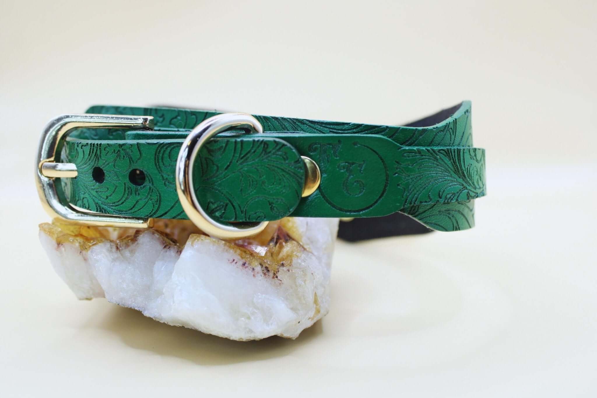 Green leather posture collar with floral embossing, perfect for discreet BDSM style and submissive jewelry.