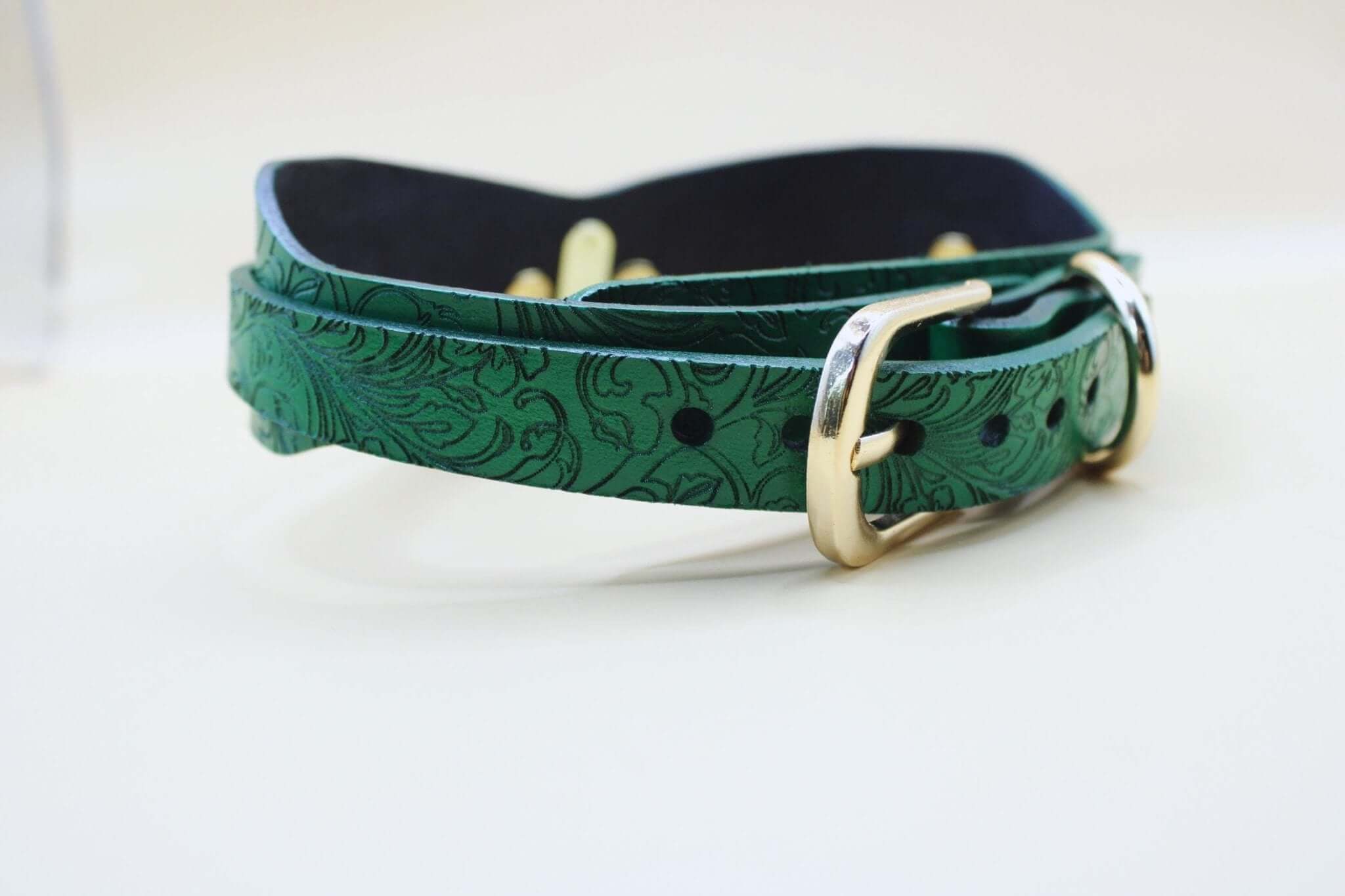Green posture BDSM collar featuring floral embossing, perfect for discreet sub styles and bondage jewelry.
