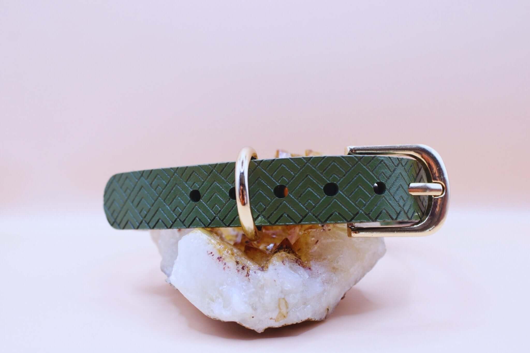 Green geometric leather submissive collar with gold buckle, perfect for bdsm jewelry and discreet day wear.