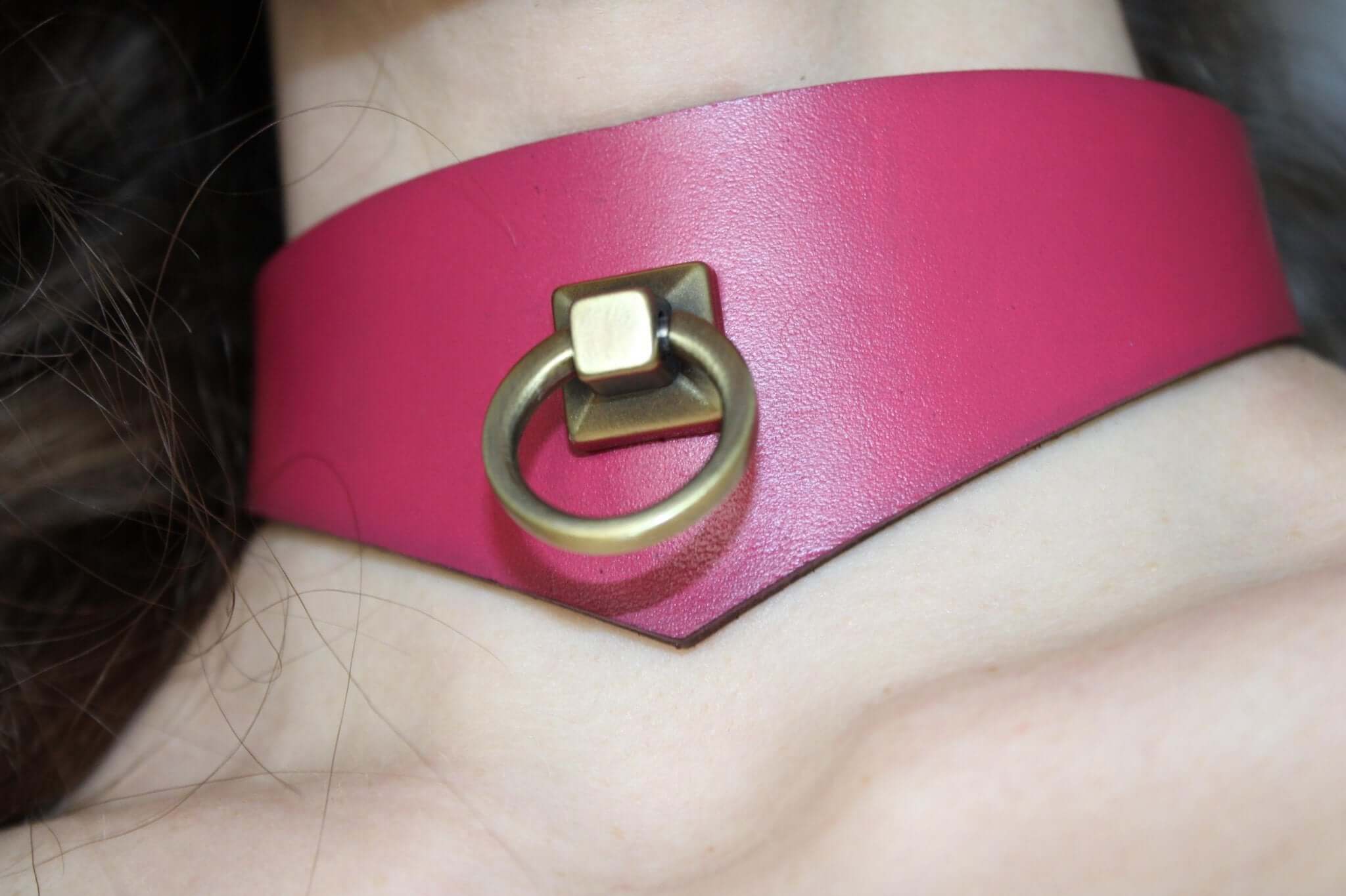Handcrafted pink leather BDSM collar with metal ring, perfect as a submissive choker or discreet day collar for bondage.