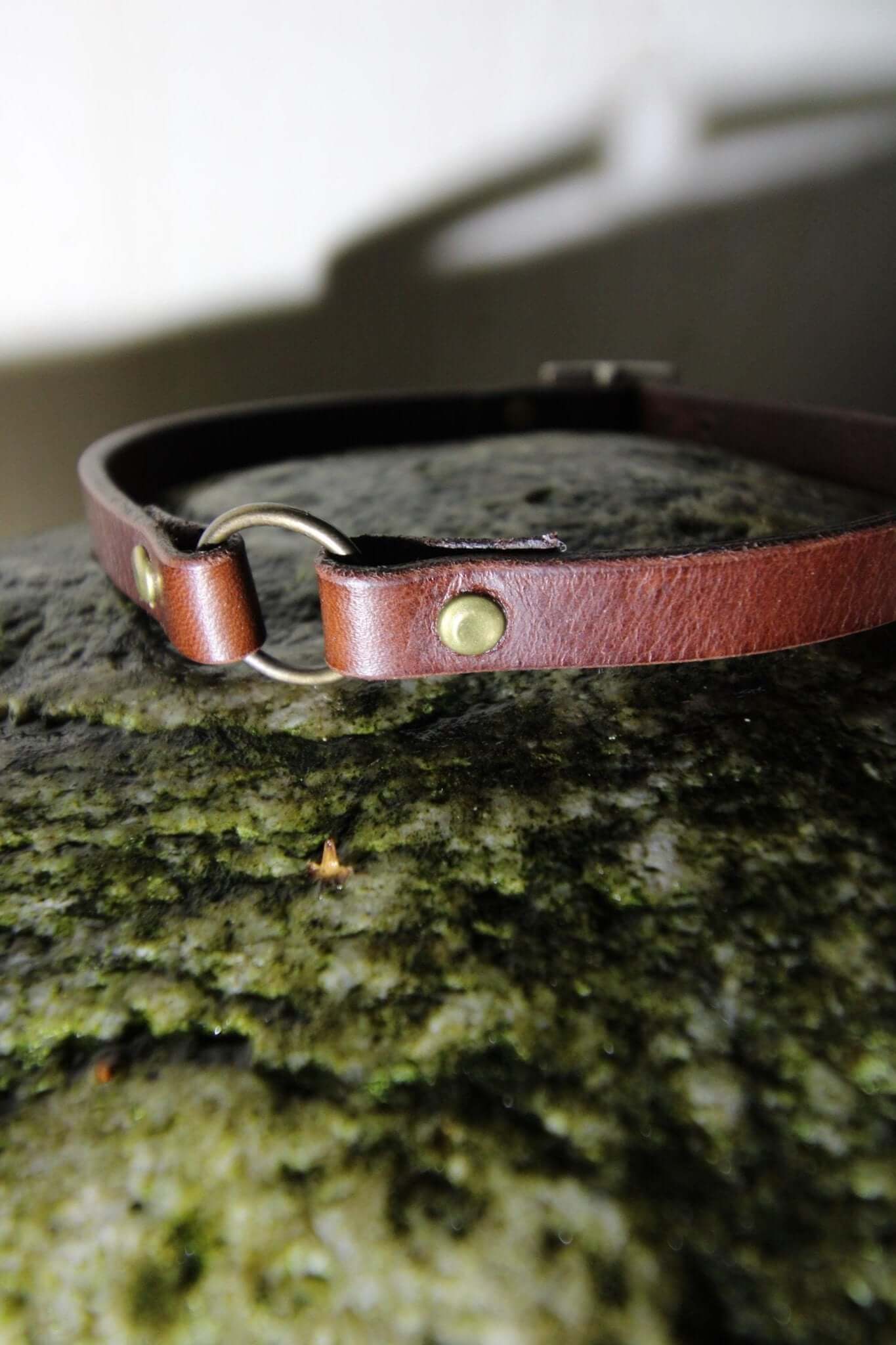 Handcrafted leather O-ring choker, a gothic bondage collar for alternative fashion and BDSM enthusiasts.
