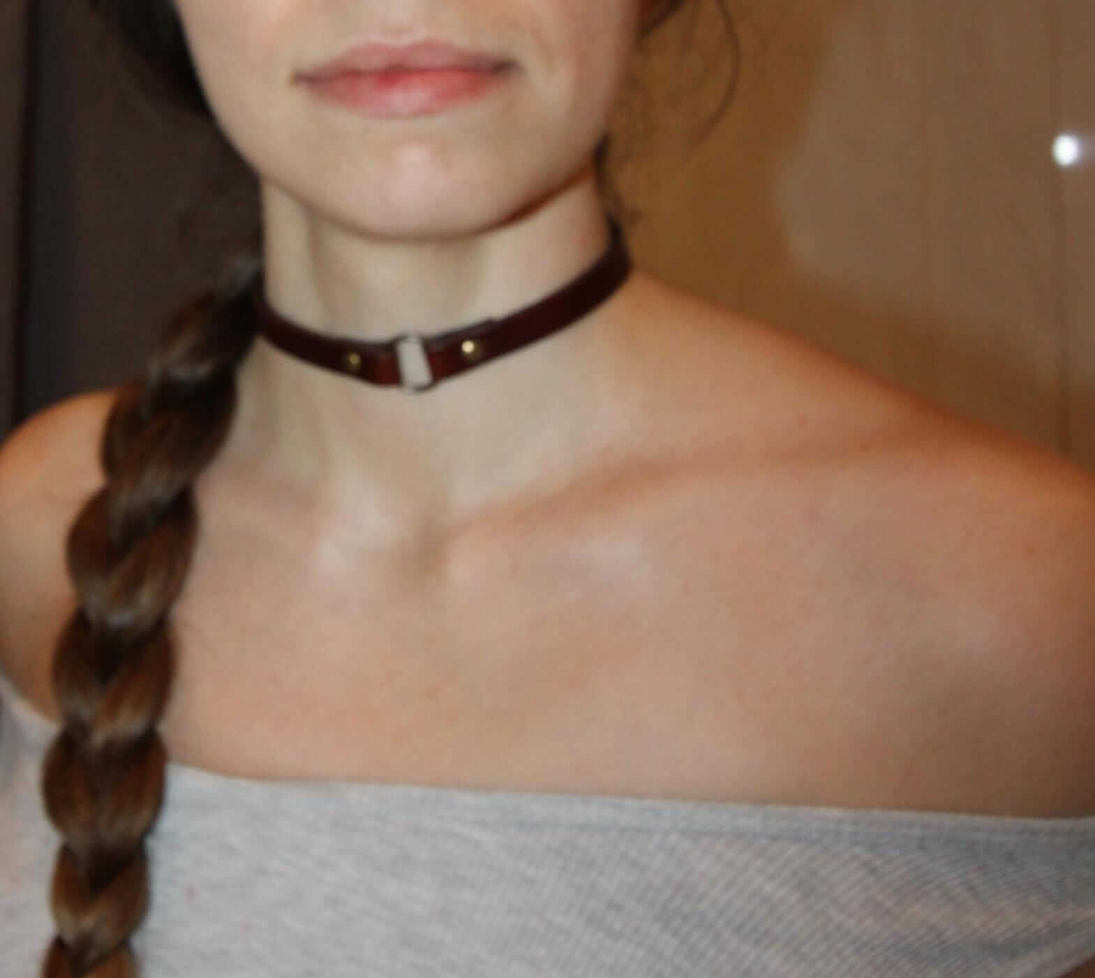 Handcrafted leather O-ring choker collar for alternative fashion and BDSM, perfect for edgy looks and submissive jewelry.