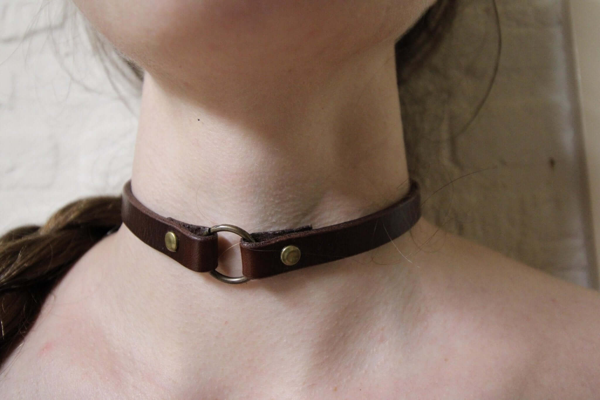 Handcrafted leather O-Ring choker collar for alternative fashion, perfect for BDSM and submissive jewelry enthusiasts.