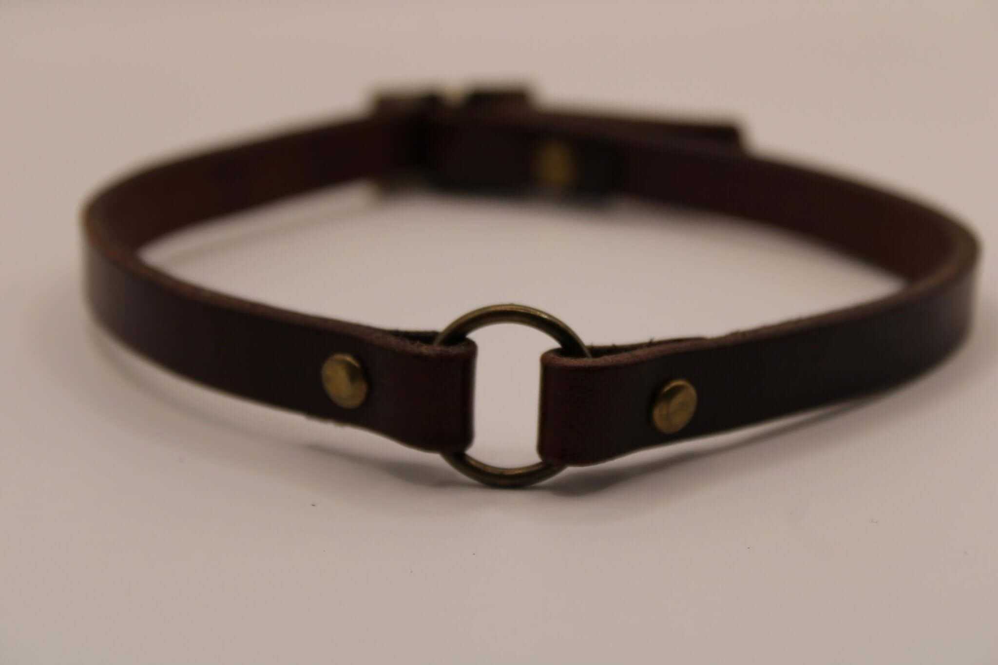 Handcrafted leather O-ring choker, a gothic bondage collar for alternative fashion, perfect for sub collar discreet style.