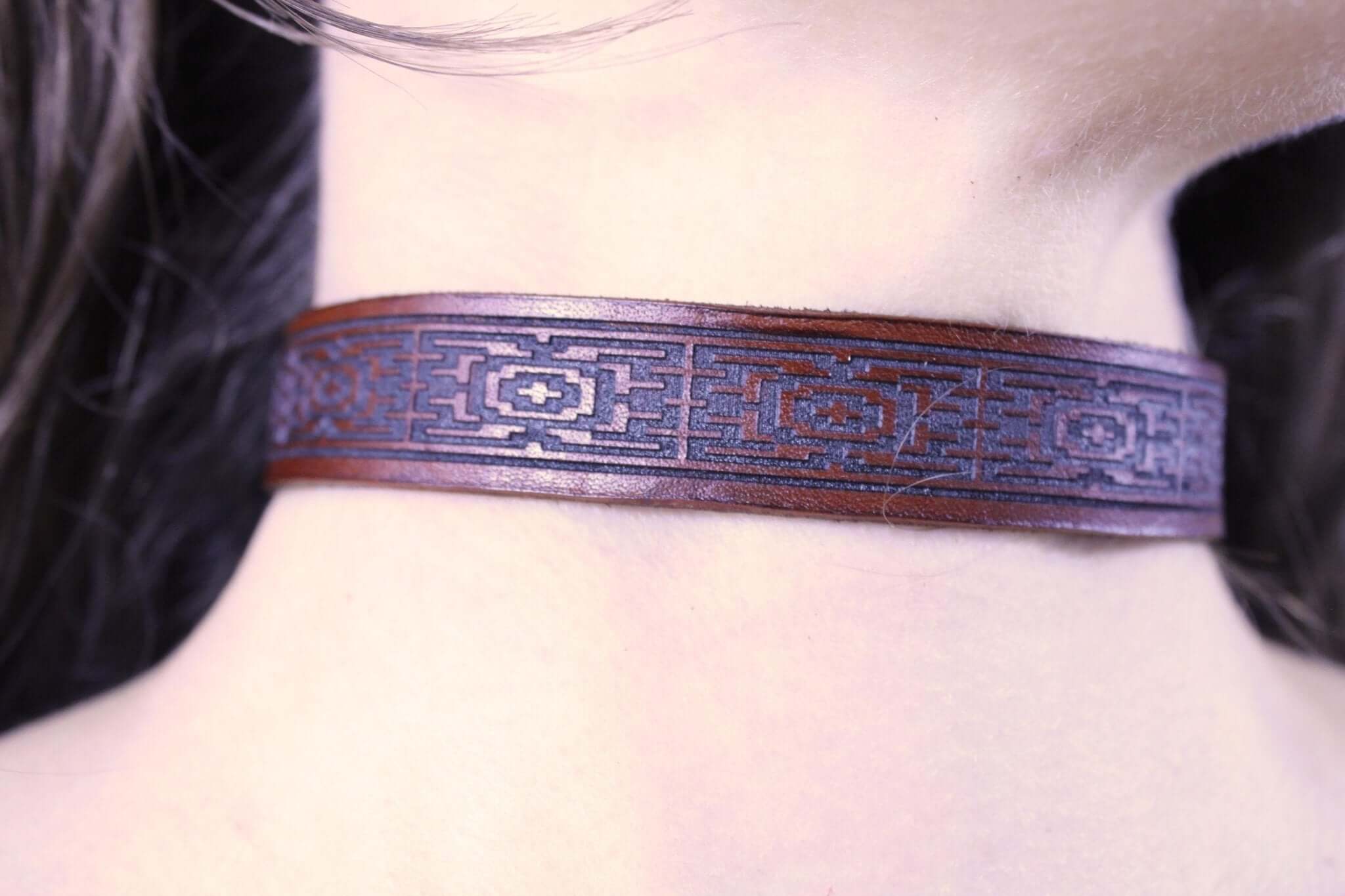Handcrafted leather submissive collar with intricate geometric pattern, perfect for BDSM, dom sub gifts, and discreet day wear.