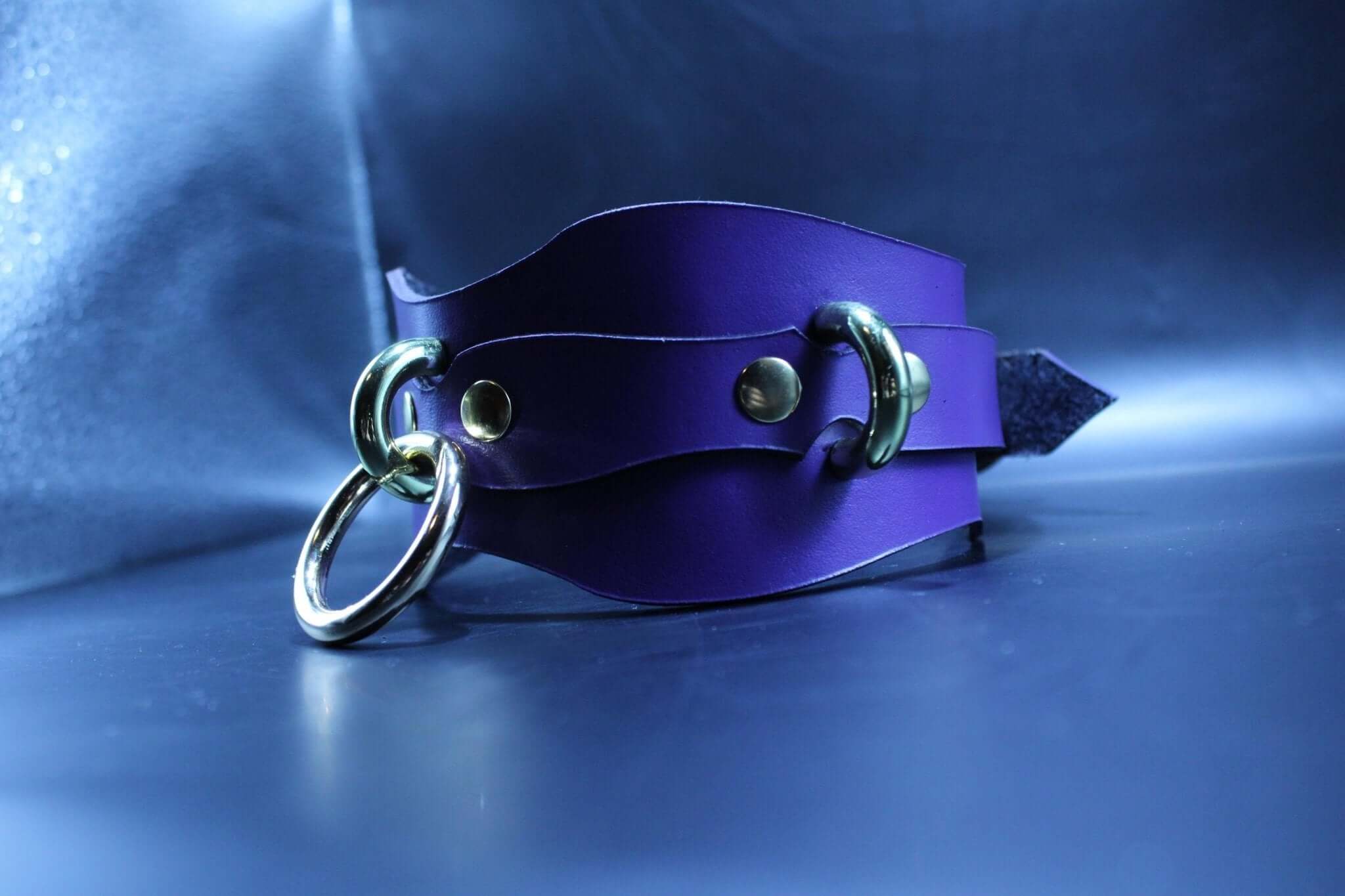 Purple handcrafted leather BDSM collar with metal rings, perfect for submissive jewelry and bondage gear.