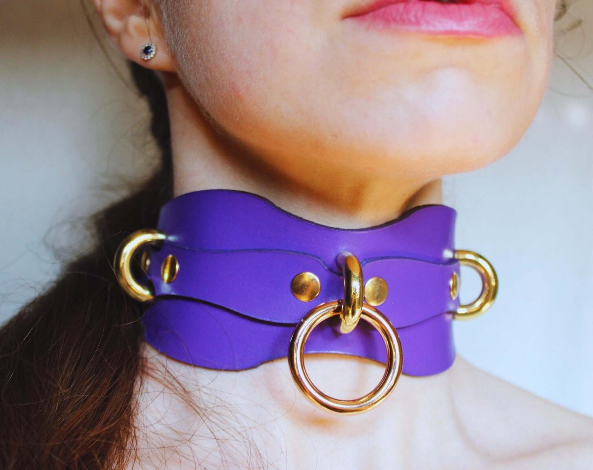 Handcrafted purple leather BDSM collar with gold rings, perfect for submissive jewelry and bondage accessories.