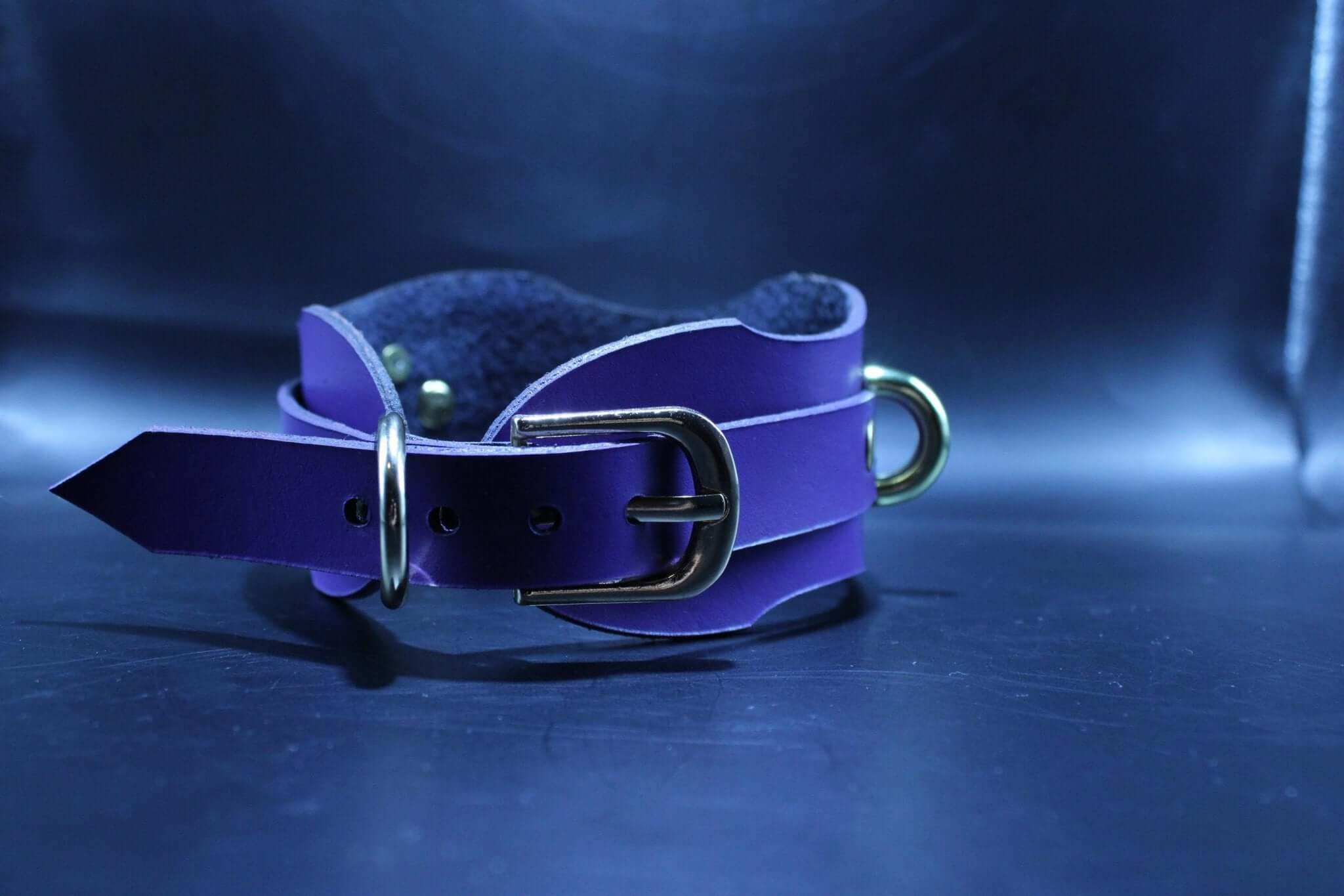 Luxurious purple handcrafted leather BDSM collar, perfect for submissive jewelry and bondage gear enthusiasts.