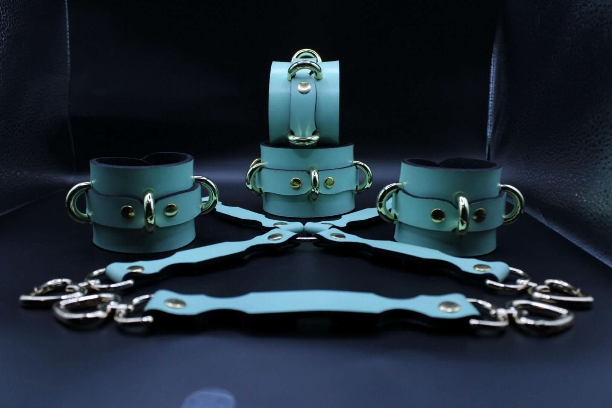 Handmade leather cuffs in mint green, adjustable bondage restraints perfect for BDSM play and submission.