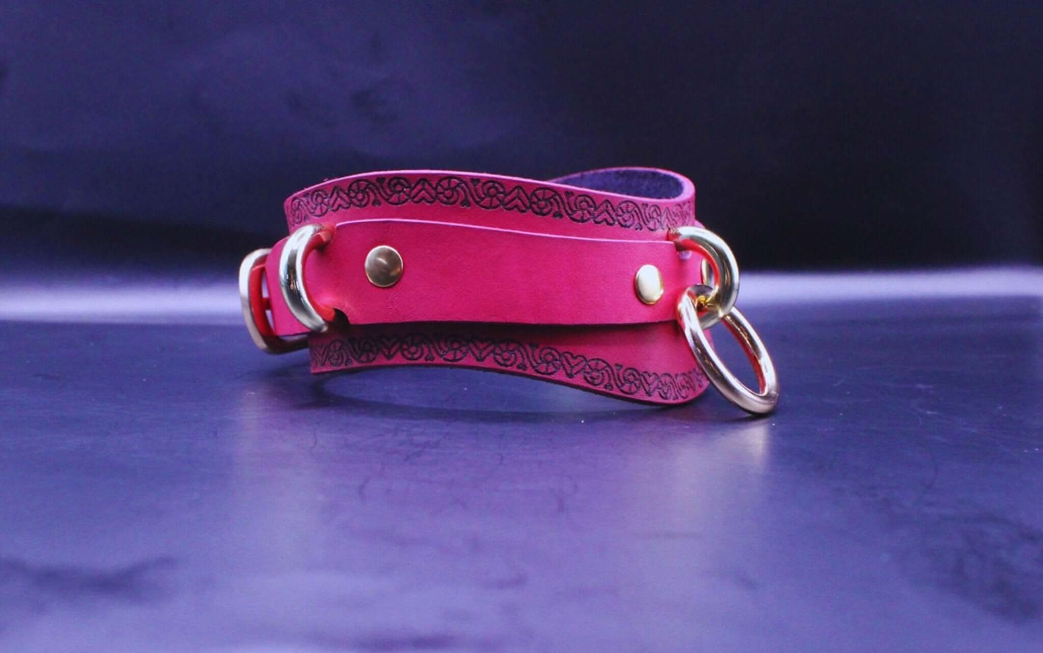 Handcrafted pink BDSM collar with heart motif, ideal submissive jewelry and bondage accessory.