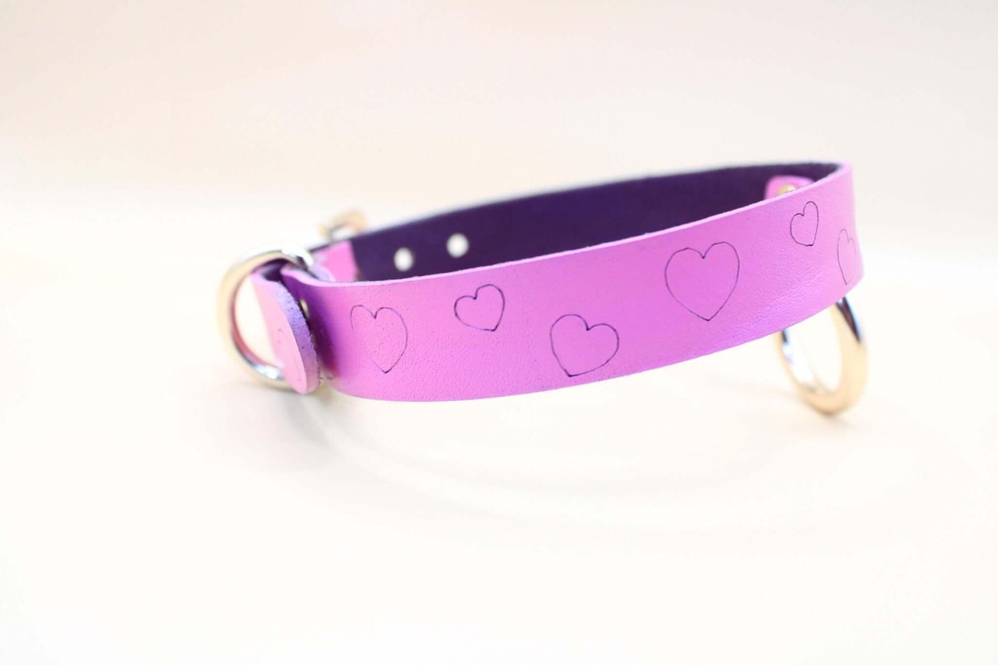 Heart print leather BDSM collar in vibrant purple, perfect for playful sub dynamics and discreet day wear.