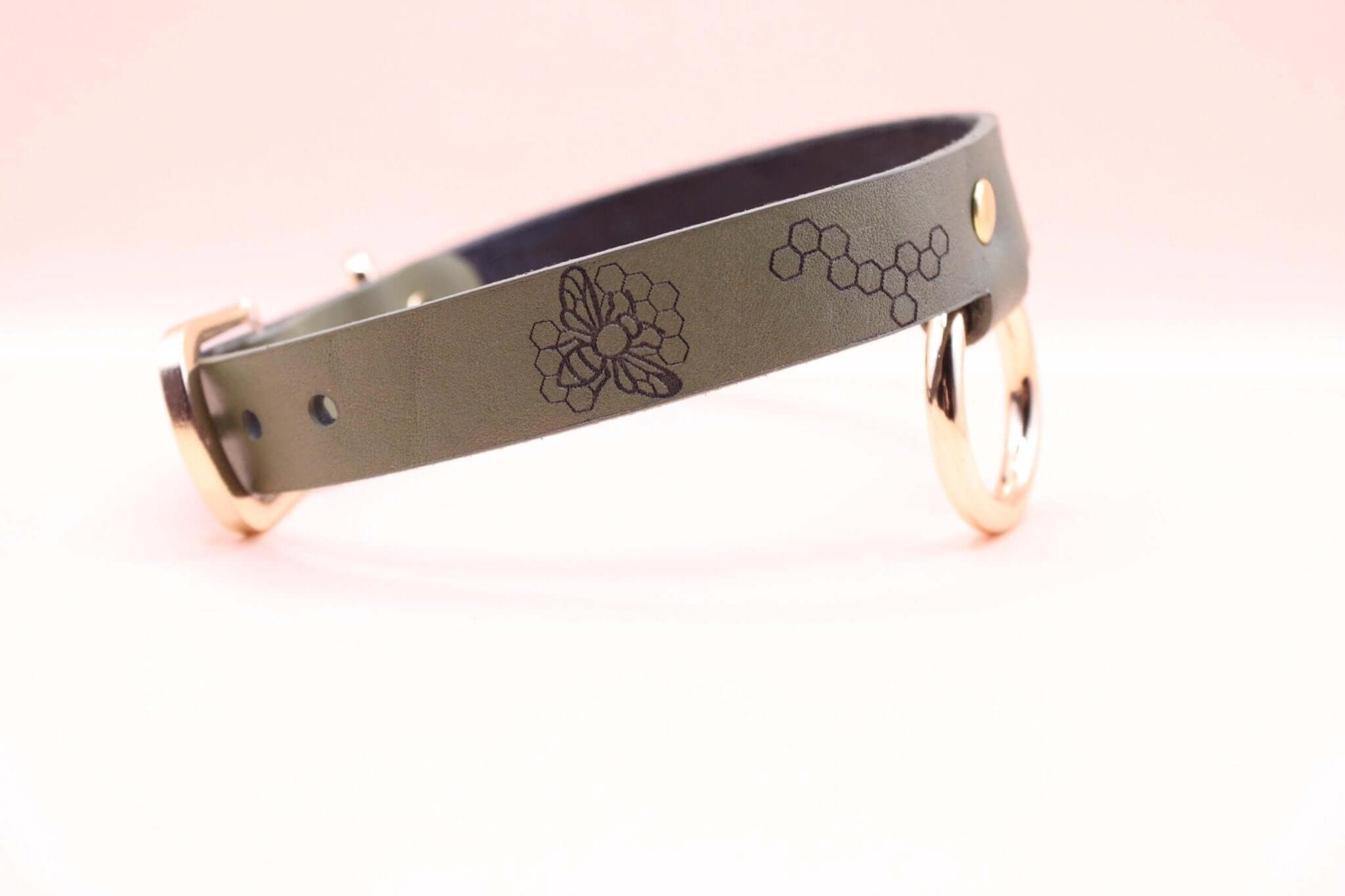 Honeycomb BDSM collar featuring a bee motif, perfect for submissive jewelry and bondage gear enthusiasts.