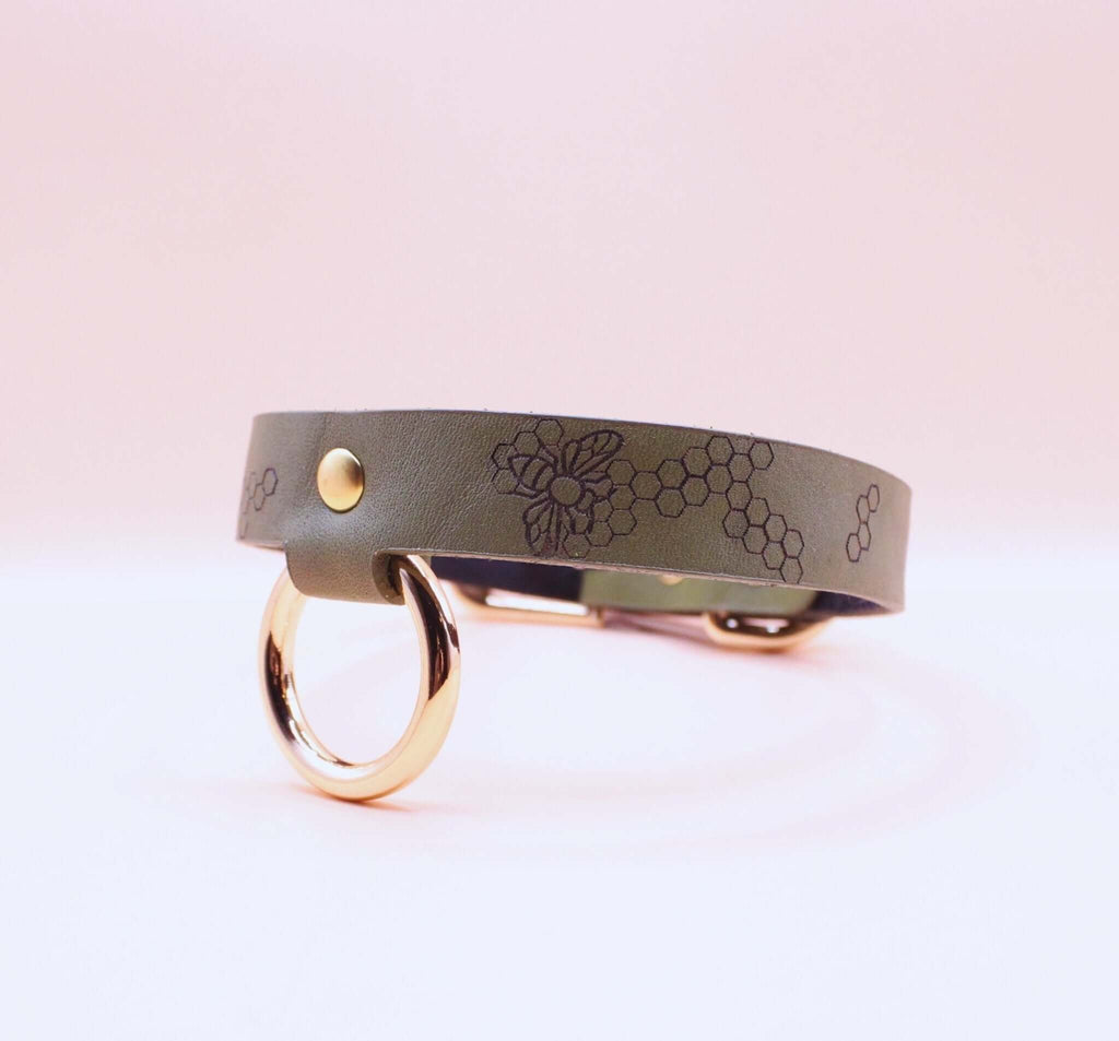 Honeycomb leather collar with O-ring, perfect for BDSM enthusiasts as a stylish submissive jewelry piece.