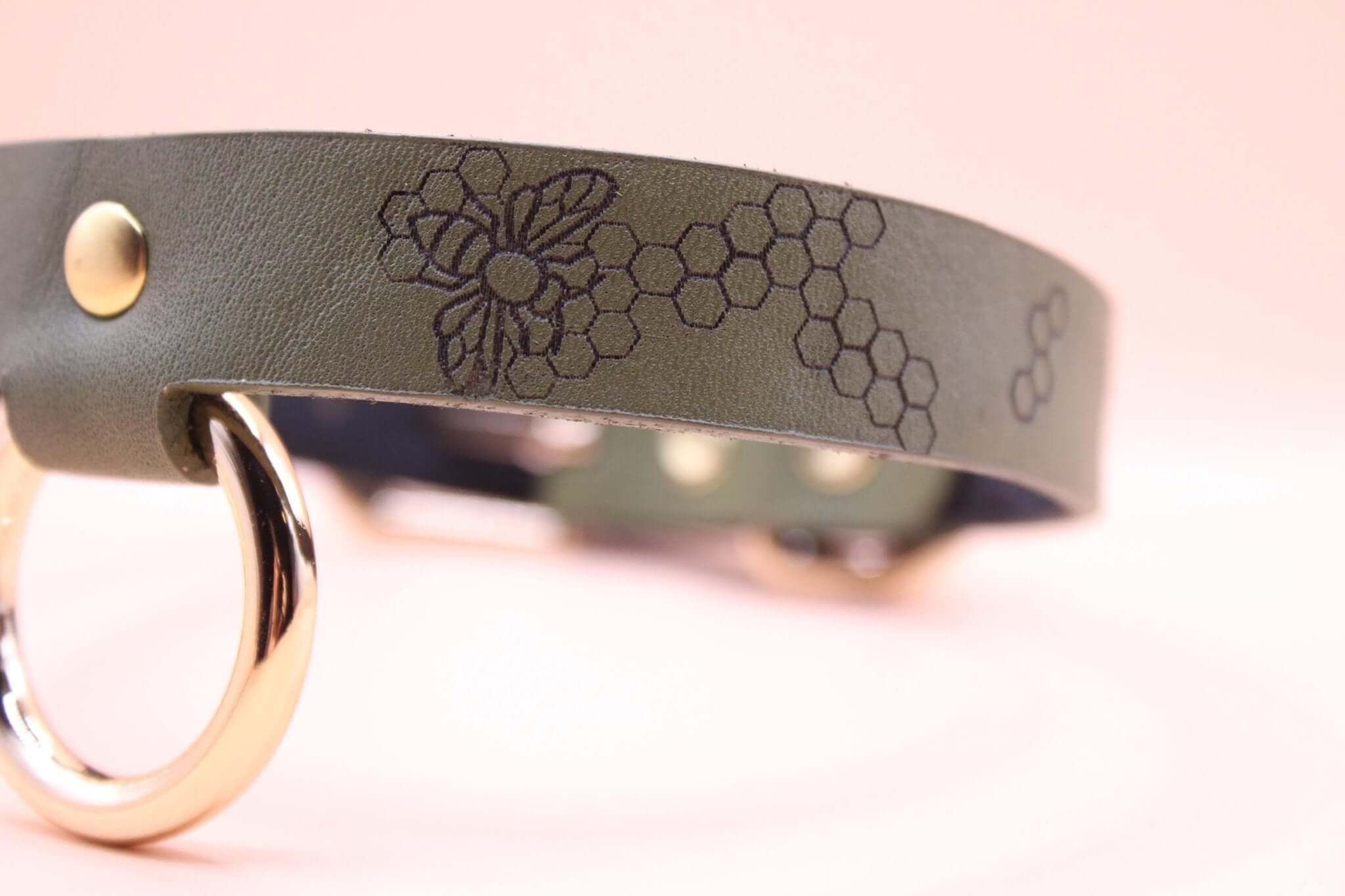 Honeycomb BDSM collar with bee motif and O-ring, perfect for submissive jewelry and bondage gear lovers.