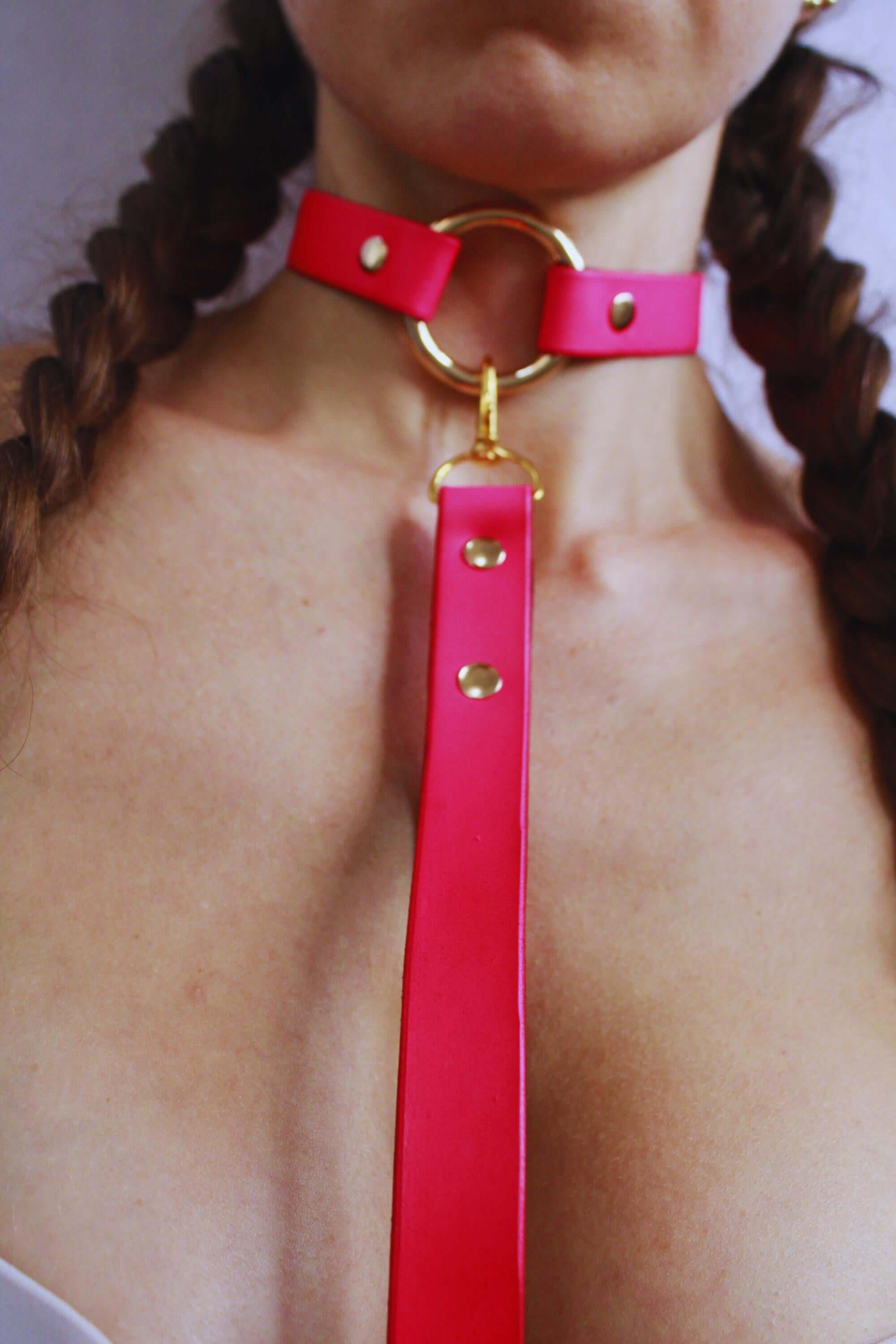 BDSM collar in Rio Red featuring a gold ring, perfect for submissive jewelry and discreet day collar use.