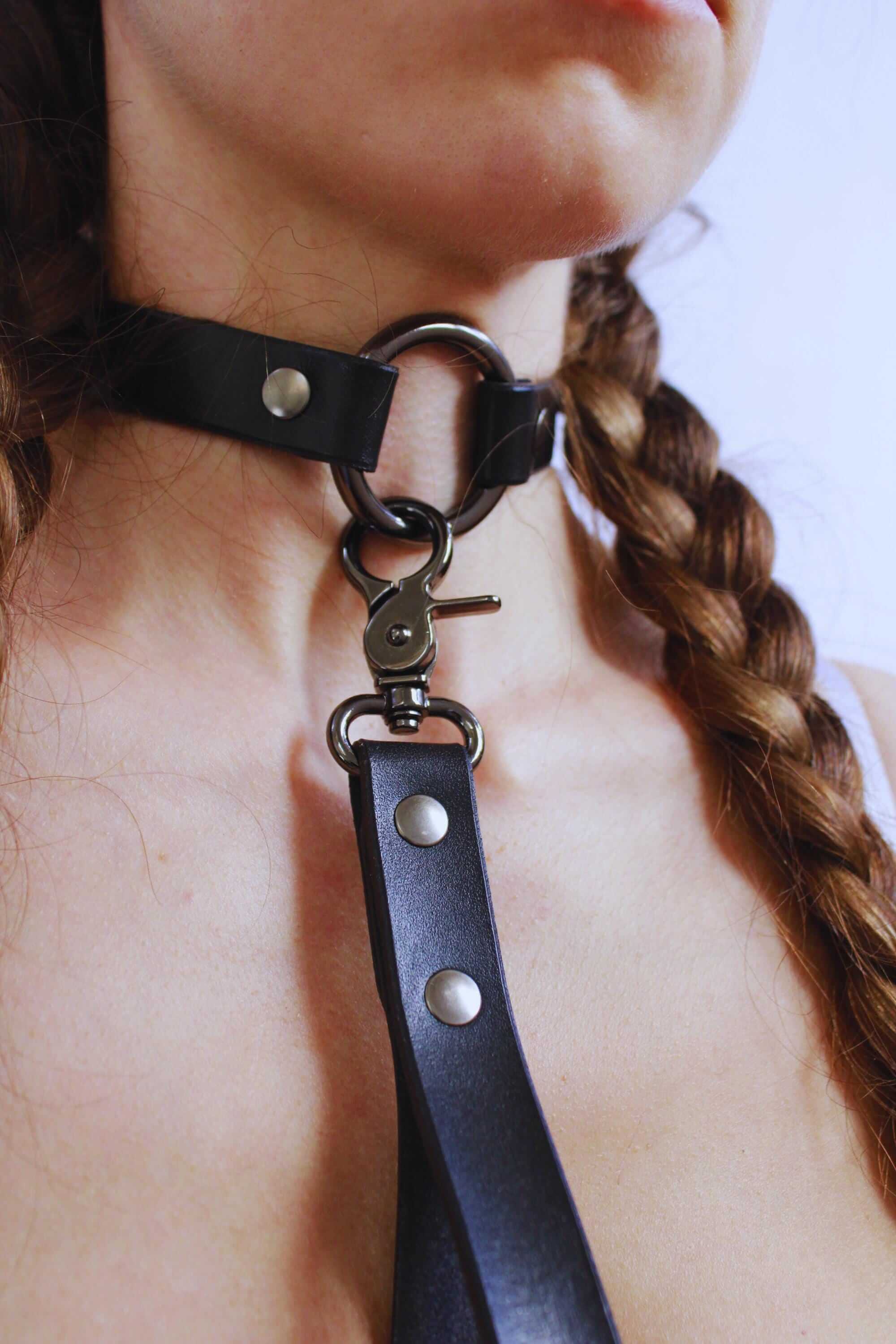Leather BDSM collar with leash, a stylish submissive necklace for discreet day wear and intimate play.