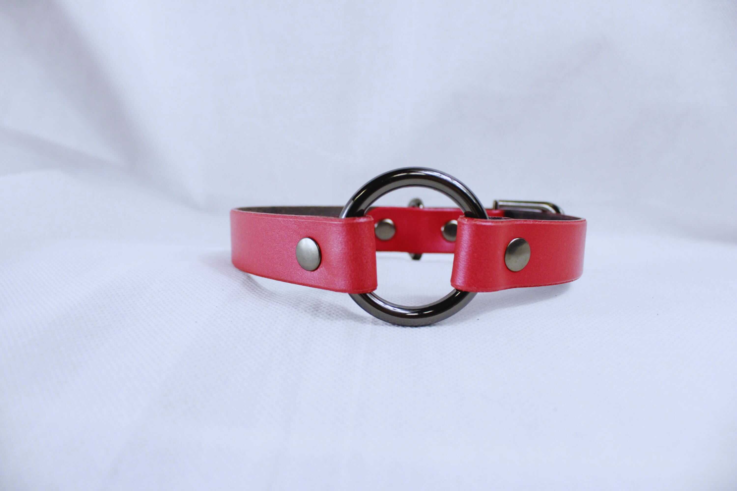 Pearl red leather BDSM collar with metal ring and snaps, perfect for discreet day wear and submissive jewelry.