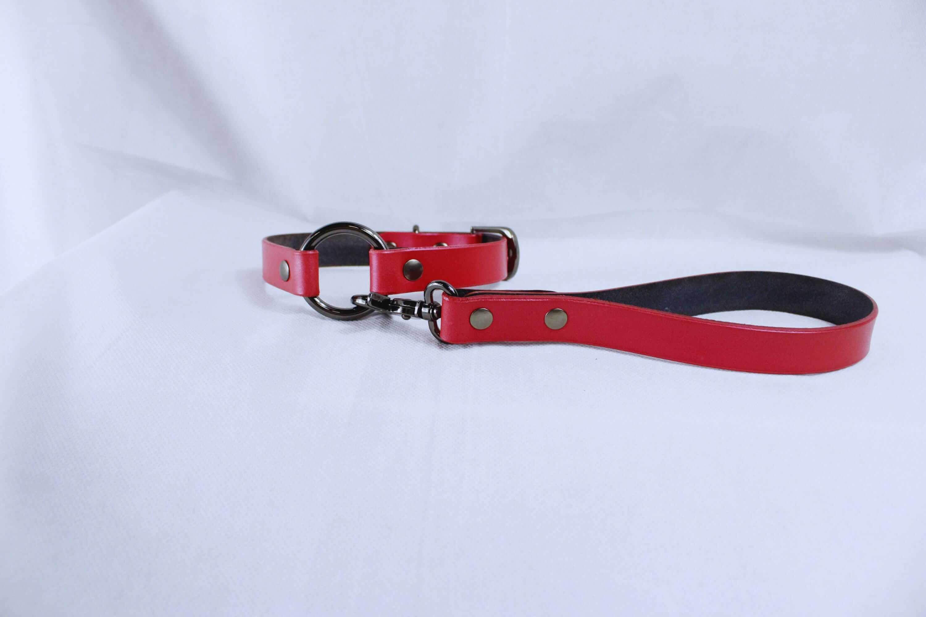 Bdsm leather leash and collar set in pearl red, perfect for submissive jewelry and bondage gear.