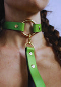 Elegant pearl green submissive collar with gold hardware, perfect for discreet day wear and BDSM aesthetics.