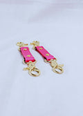 Hot pink BDSM connectors with gold hardware for cuffs, collars and bondage play, perfect for submissive jewelry and gear.