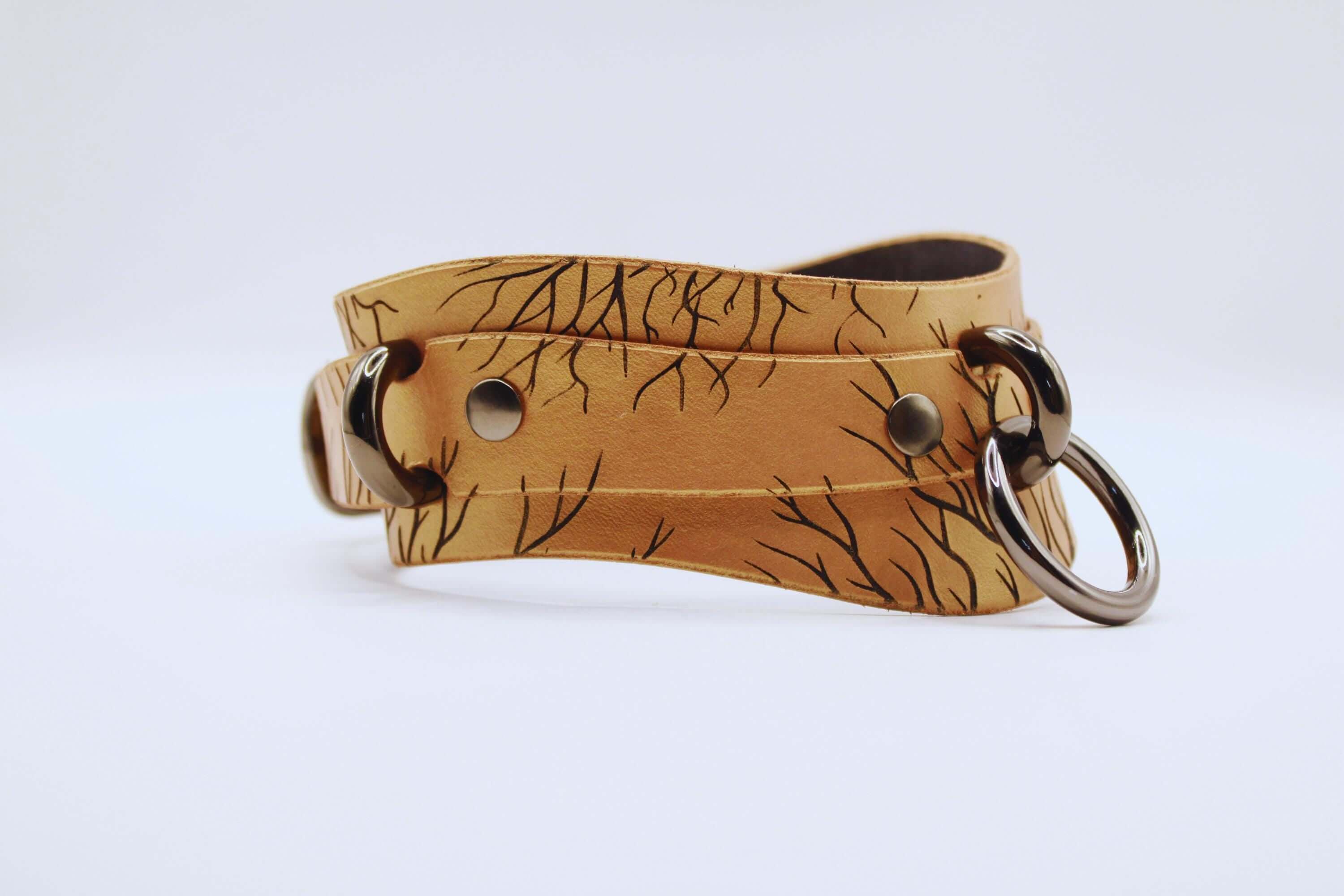 Handcrafted submissive collar in genuine leather with nature-inspired pattern, perfect for daily wear as a BDSM Collar.
