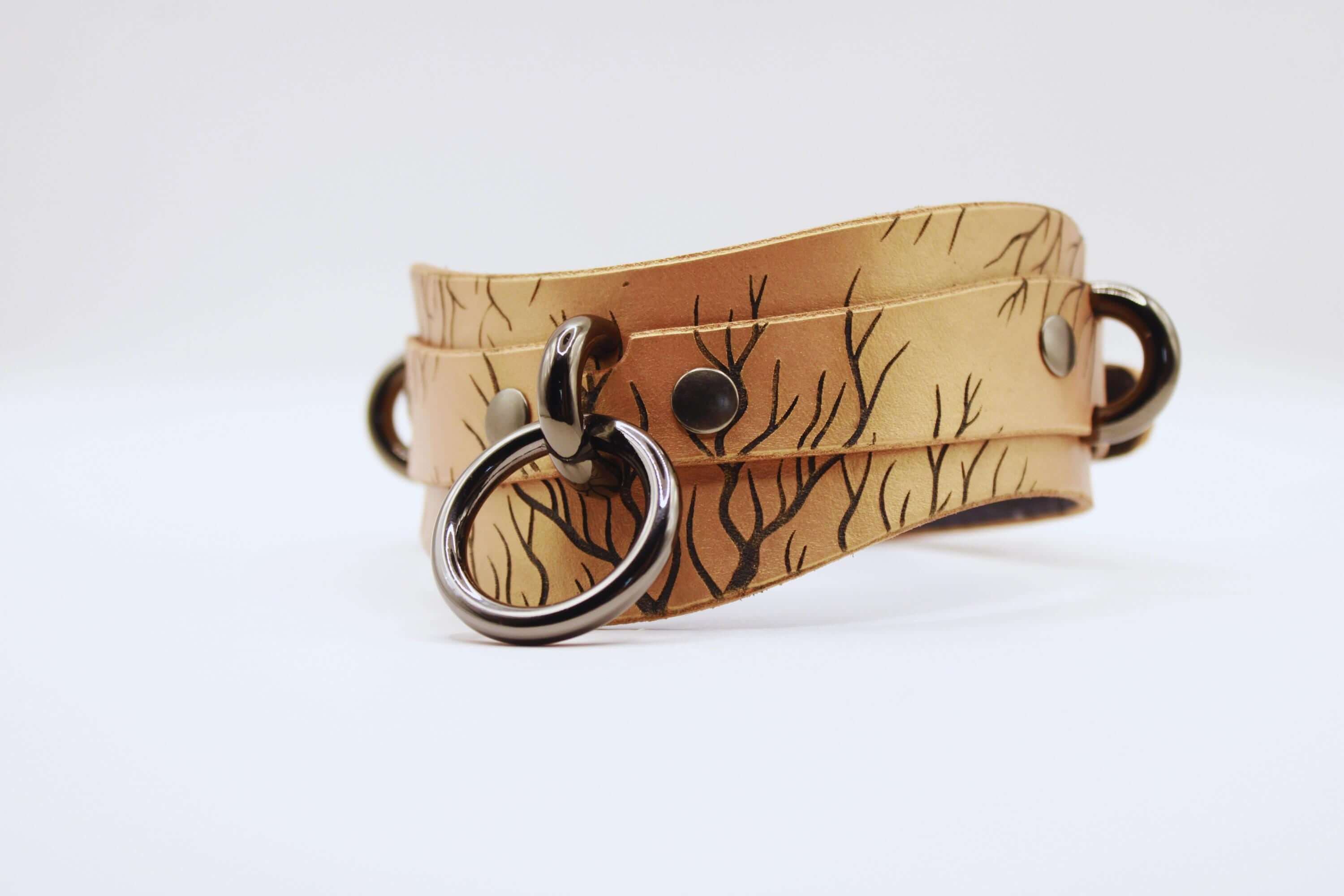 Elegant submissive collar made of high-quality leather featuring a nature-inspired design, perfect for daily wear.