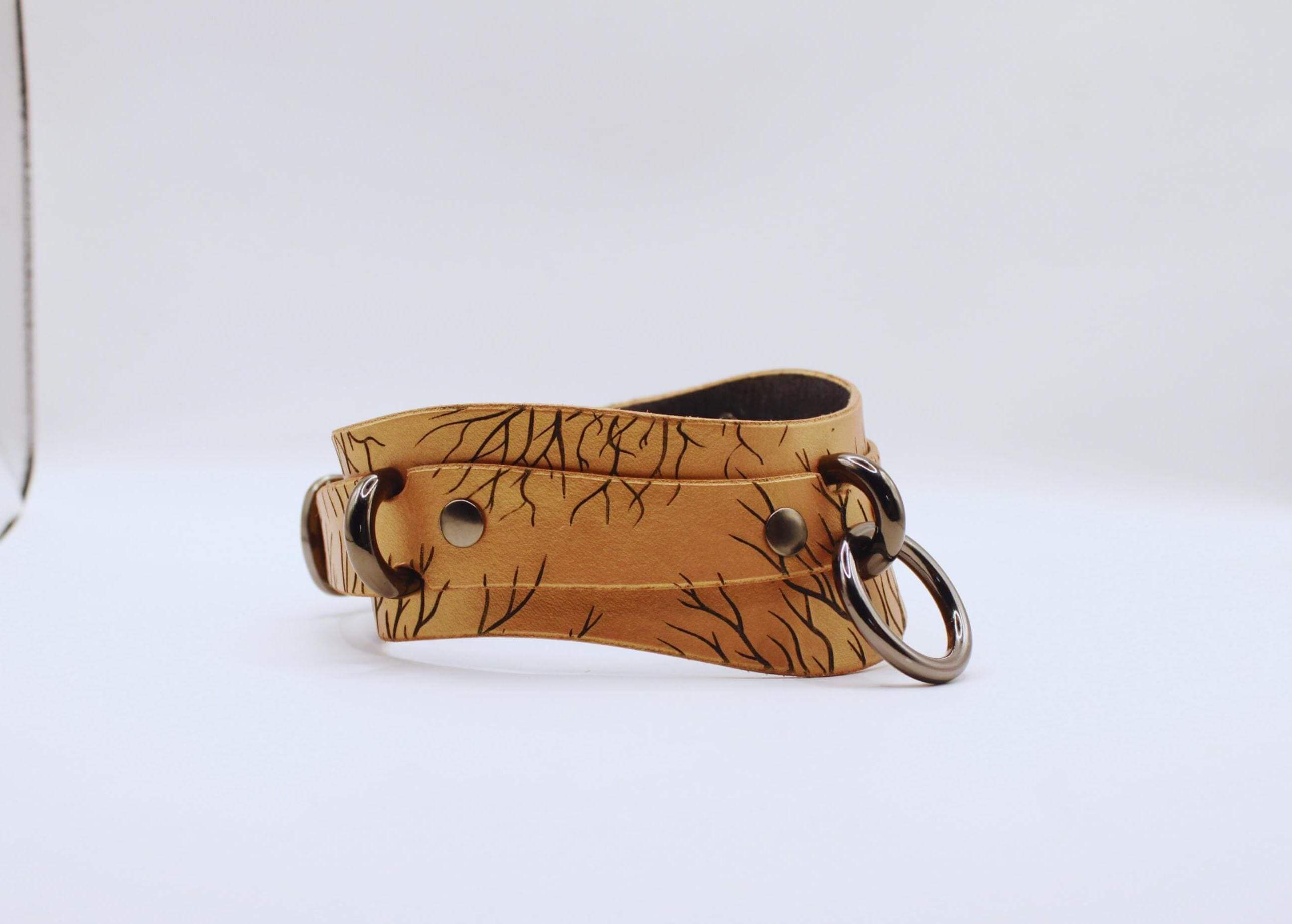 Handcrafted submissive collar in genuine leather with intricate design, perfect for BDSM and everyday wear.