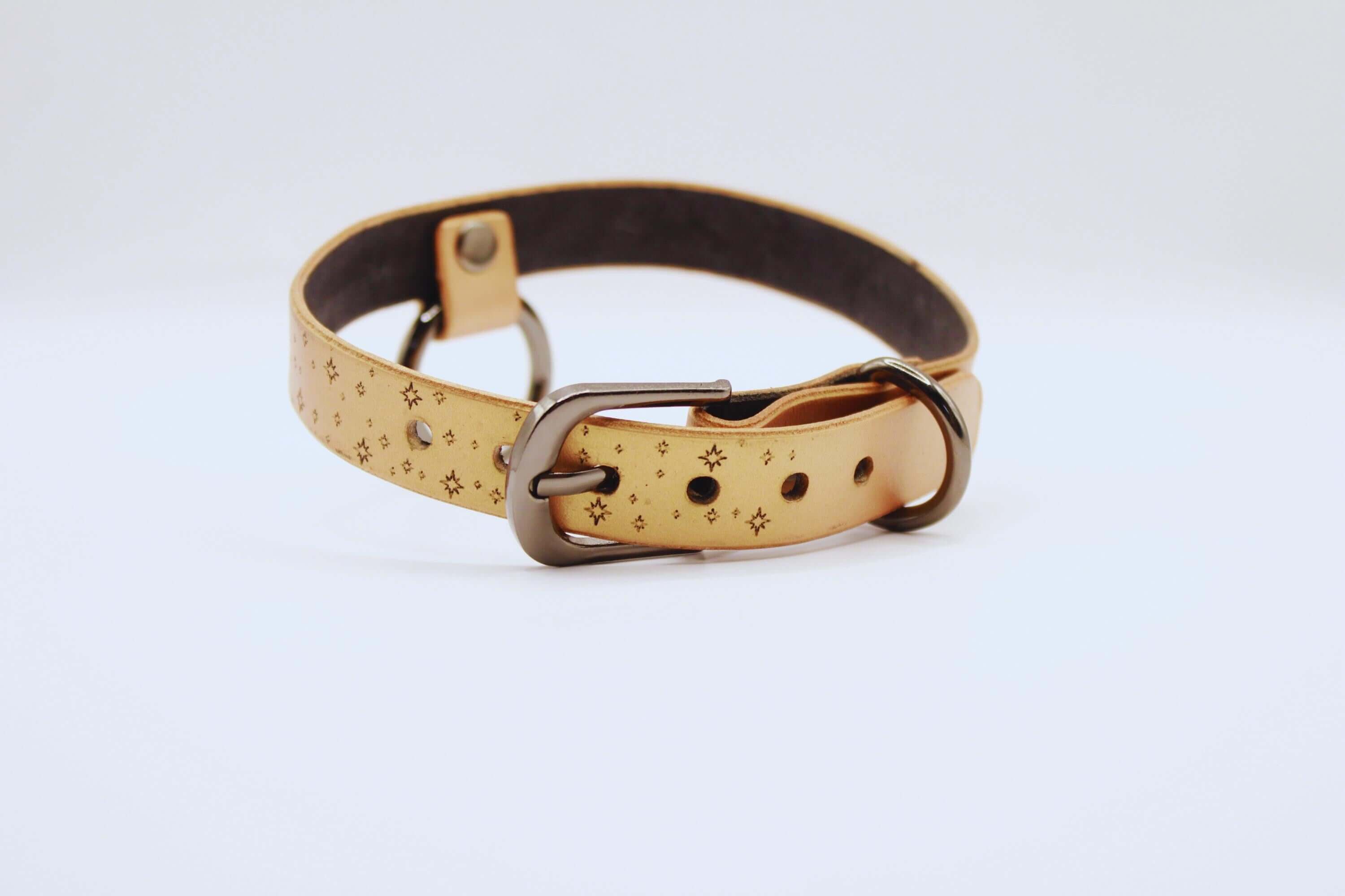 Elegant leather choker with moon and stars design, perfect minimalist statement necklace for everyday wear.