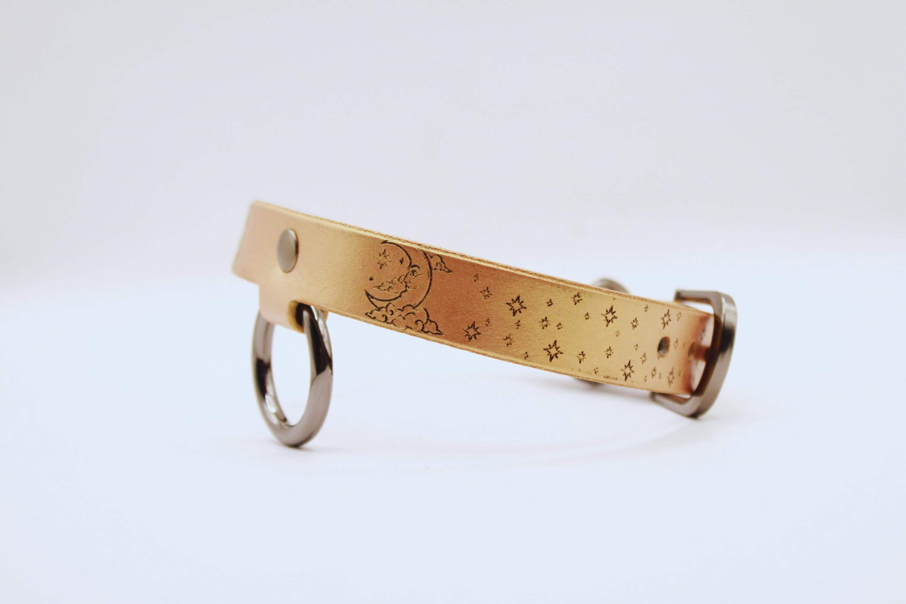 Elegant leather choker with moon and stars motif, perfect minimalist statement necklace for everyday wear.