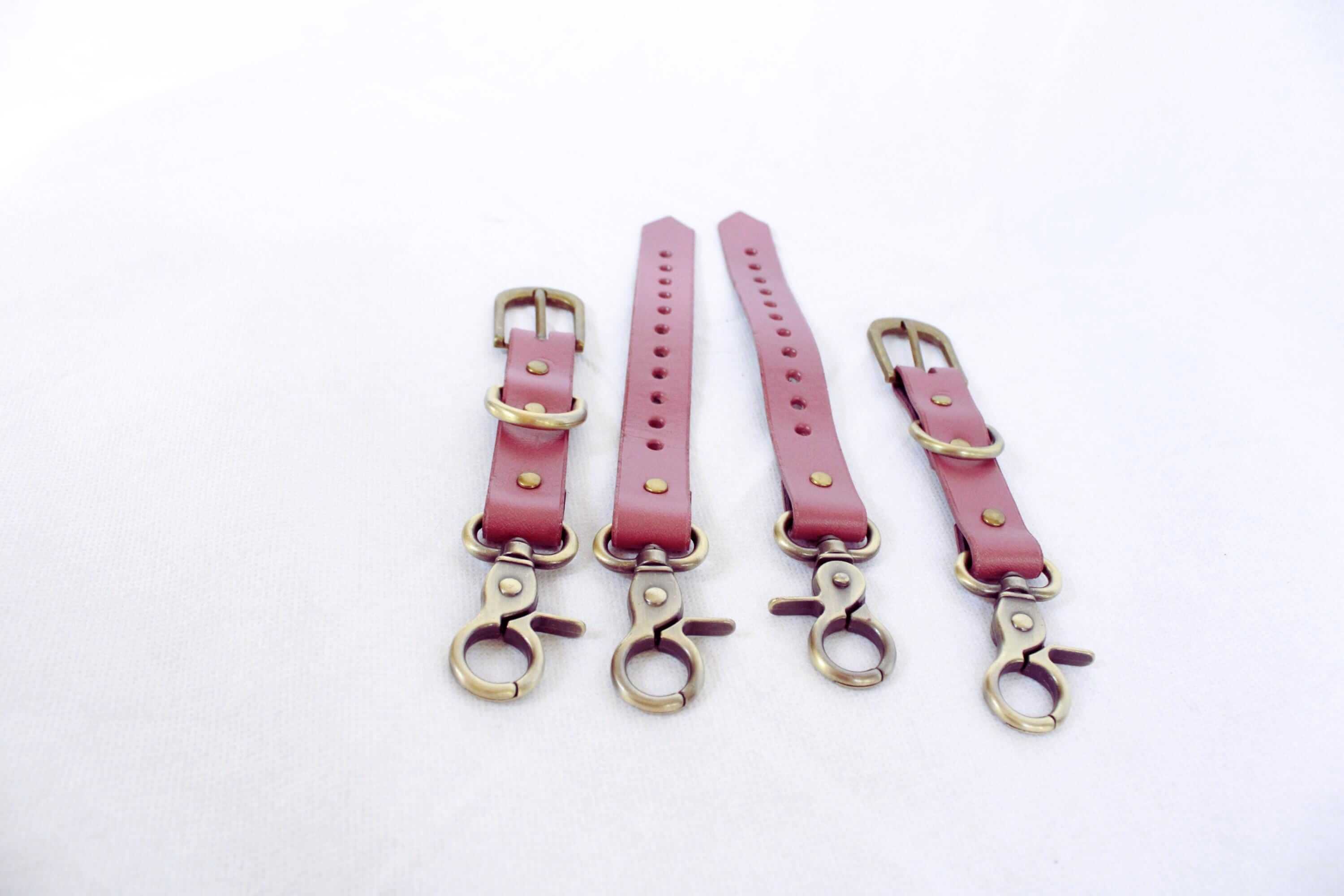Adjustable BDSM Connector – Handmade leather restraint straps with brass hardware.