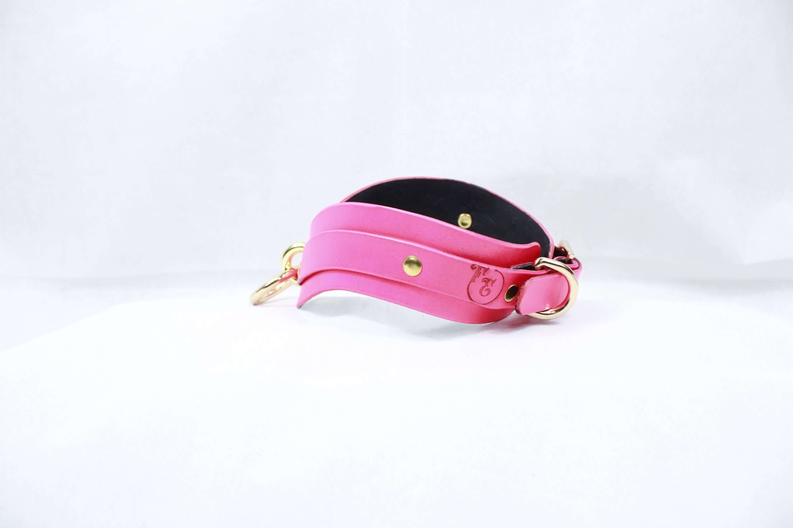Elegant pink leather BDSM collar, perfect for discreet submissive play and stylish bondage jewelry.