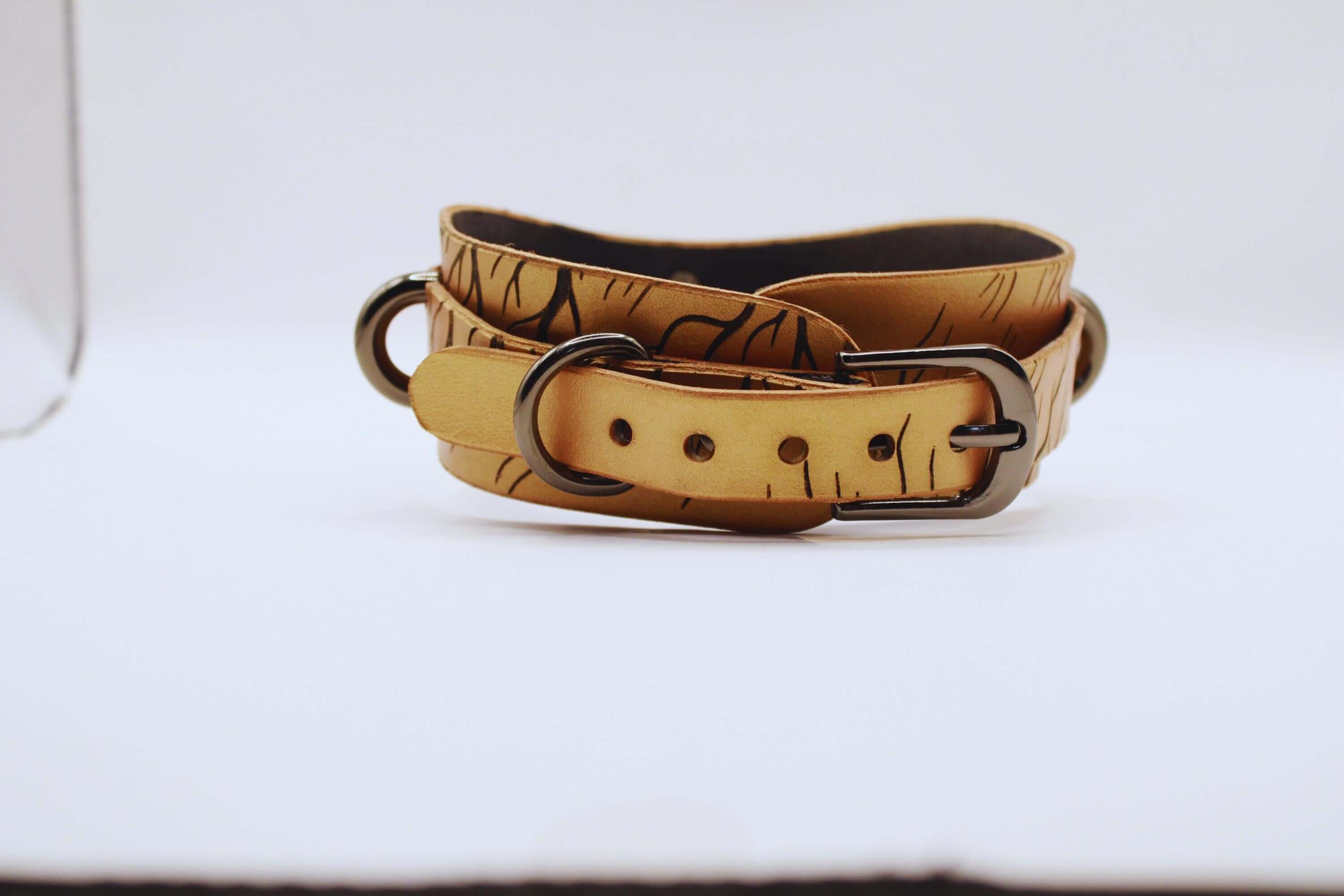 BDSM collar featuring a stylish, nature-inspired leather design for the modern submissive.