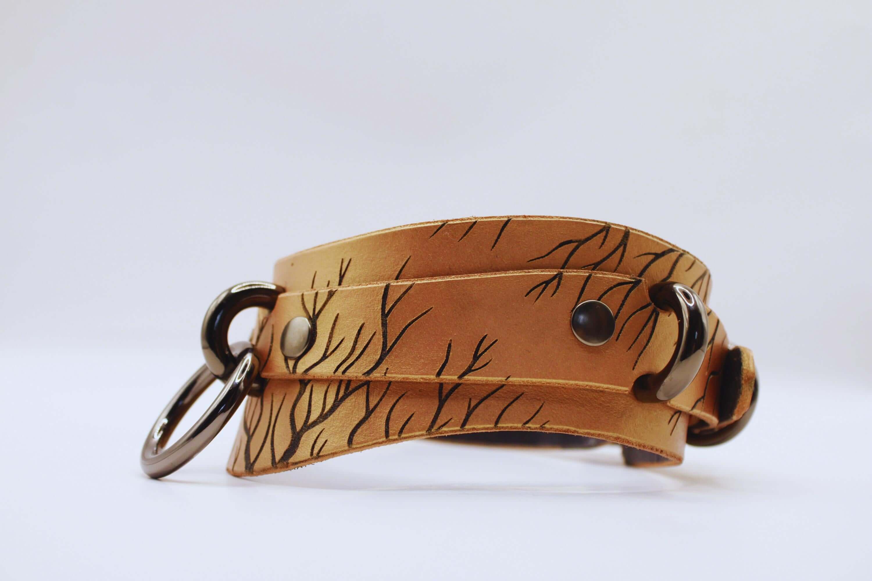 Handcrafted BDSM collar featuring a unique nature-inspired pattern, perfect for modern submissives.