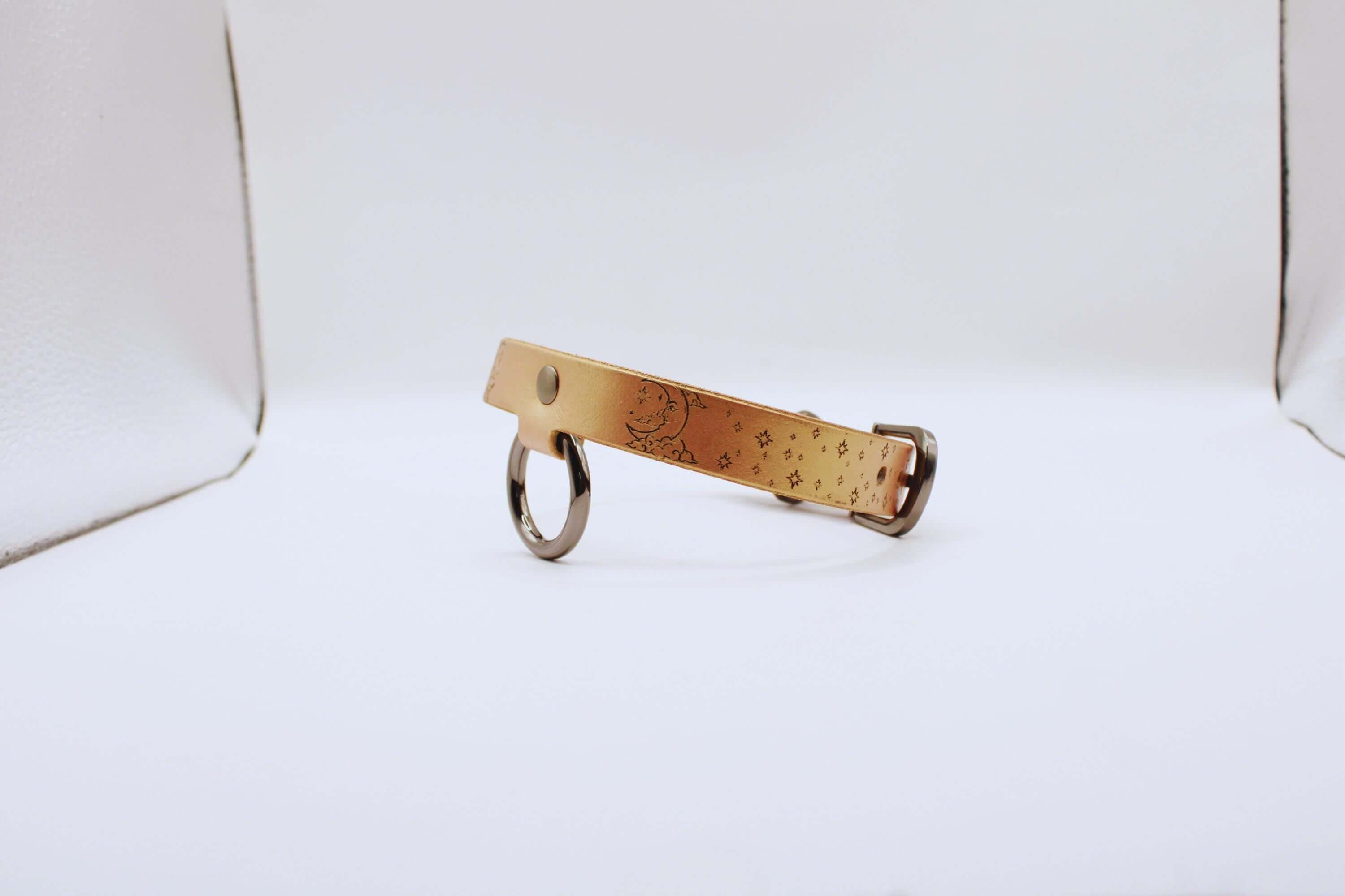 Elegant leather choker featuring crescent moon and stars, perfect statement necklace for minimalists.