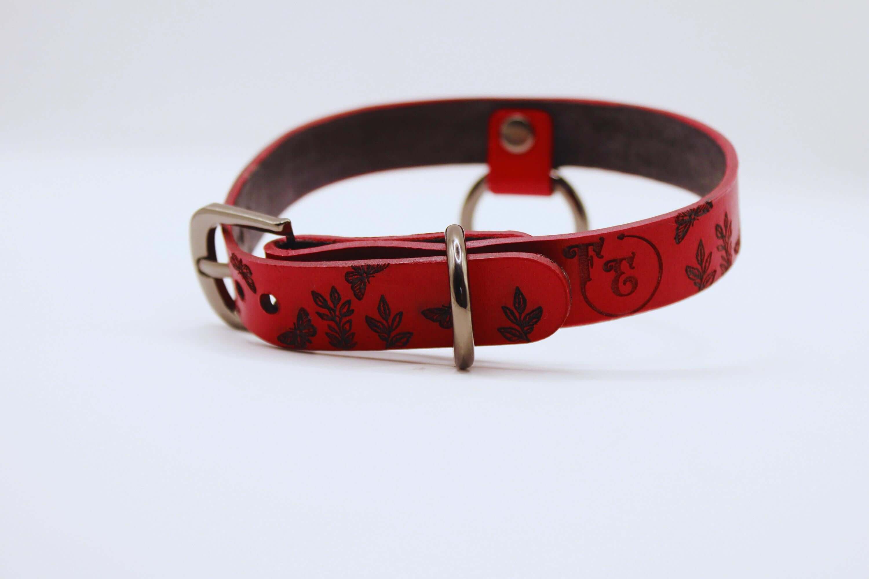 Handmade Submissive Collar in deep red leather with butterfly design, perfect for discreet BDSM fashion.