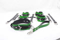 A collection of green and black leather straps and buckles arranged on a white surface.