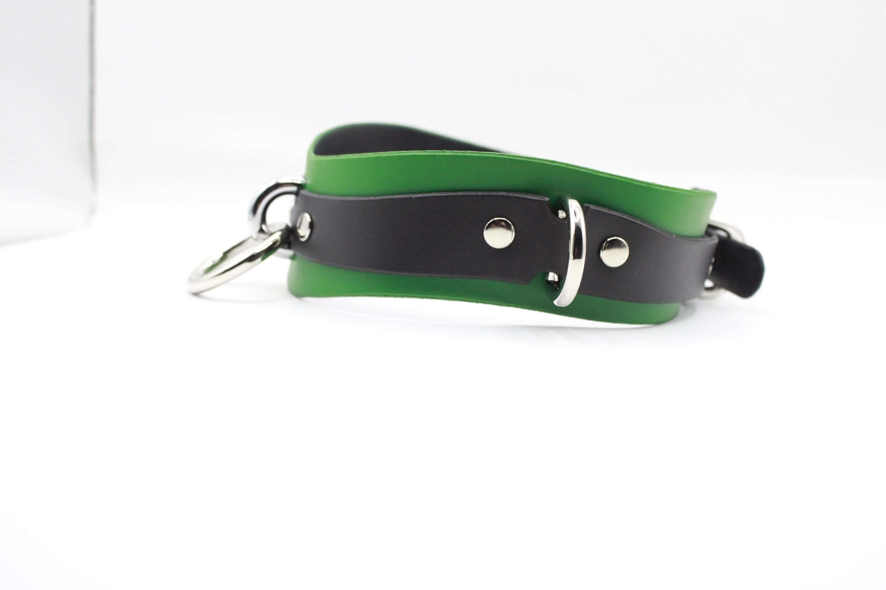 A green and black leather choker collar with metal studs and a metal buckle.