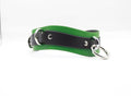 A green and black leather choker necklace with metal rings and a black leather strap.