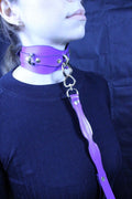 Purple leather BDSM collar with leash, perfect for submissive play, bondage gear, and D/s dynamics.