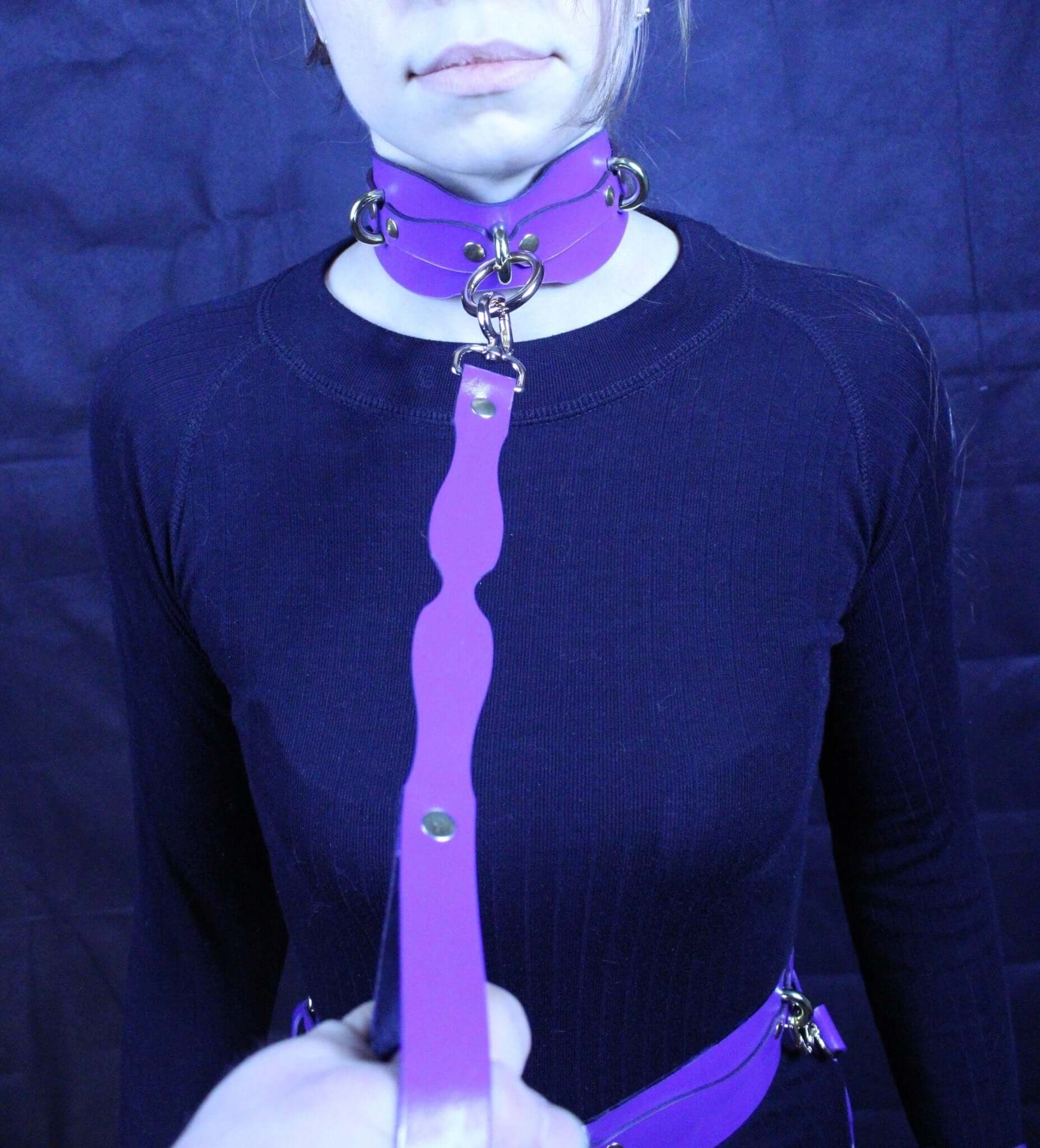 Handmade purple leather BDSM collar with leash, symbolizing submission and trust in D/s play.
