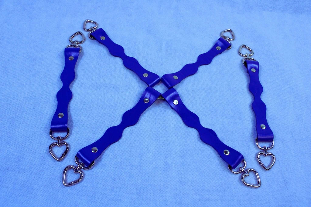 Handmade blue leather BDSM connectors with heart-shaped D-ring attachments for restraint gear and bondage accessories.